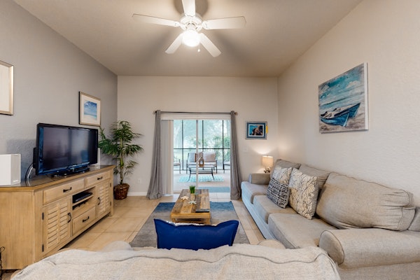 Inviting ground-floor condo with homey ambience, water view, & resort amenities