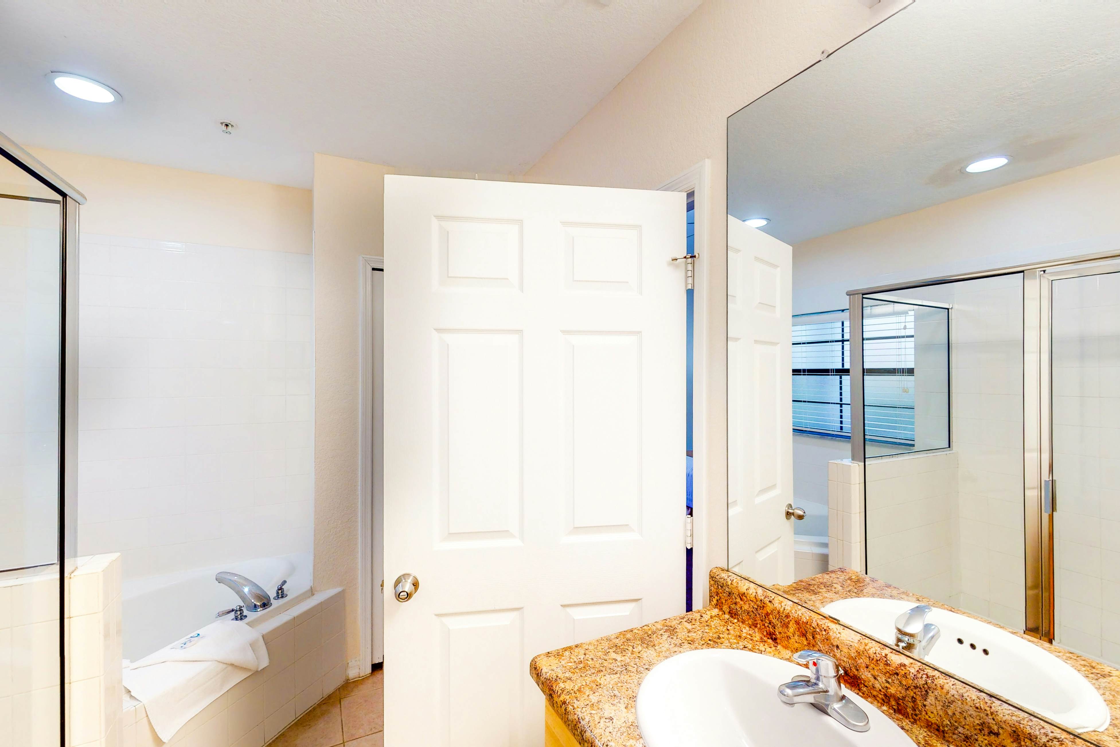 1st floor condo w/ sauna, shared pools, patio, limited-mobility access, gym