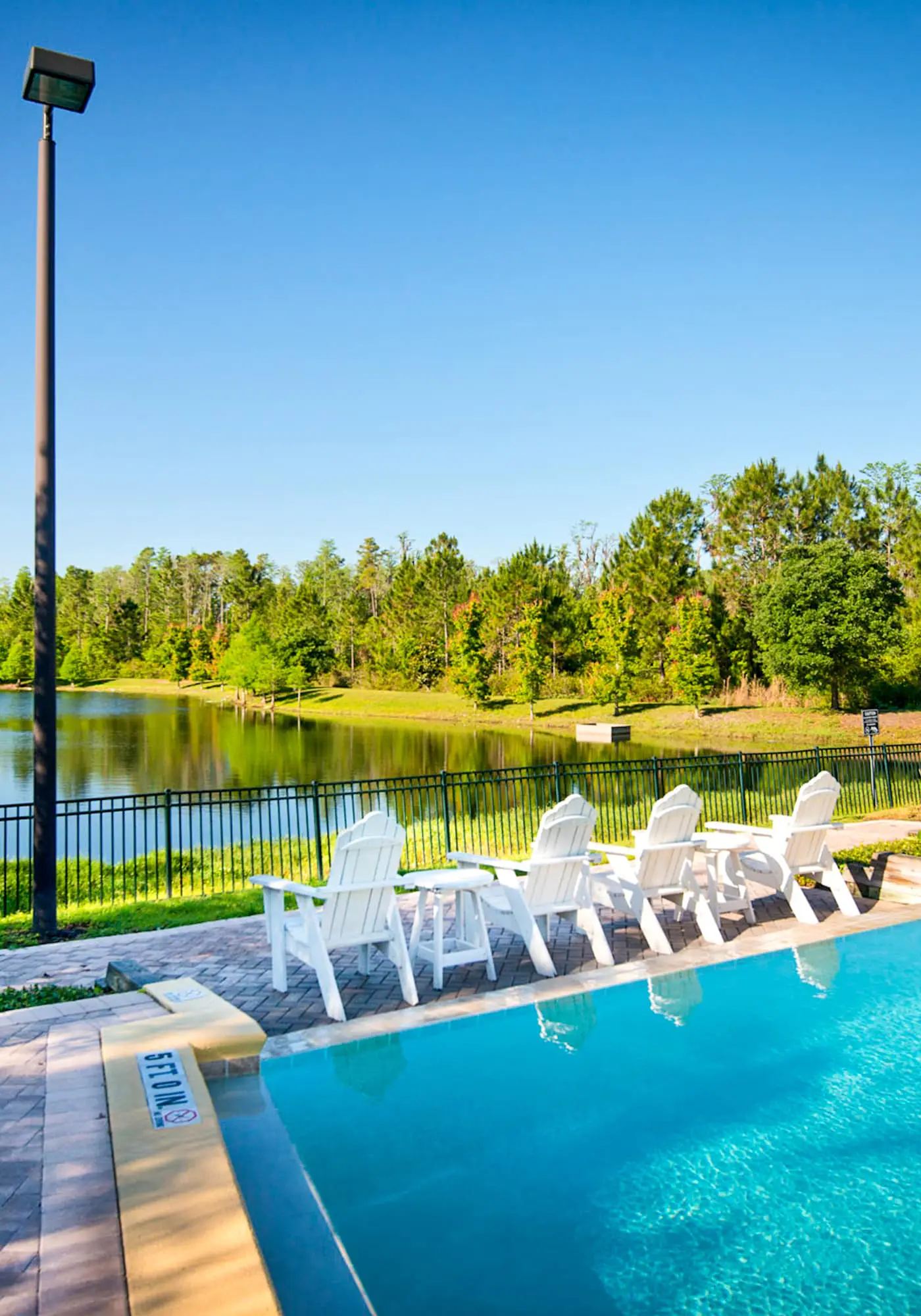 1st floor condo w/ sauna, shared pools, patio, limited-mobility access, gym