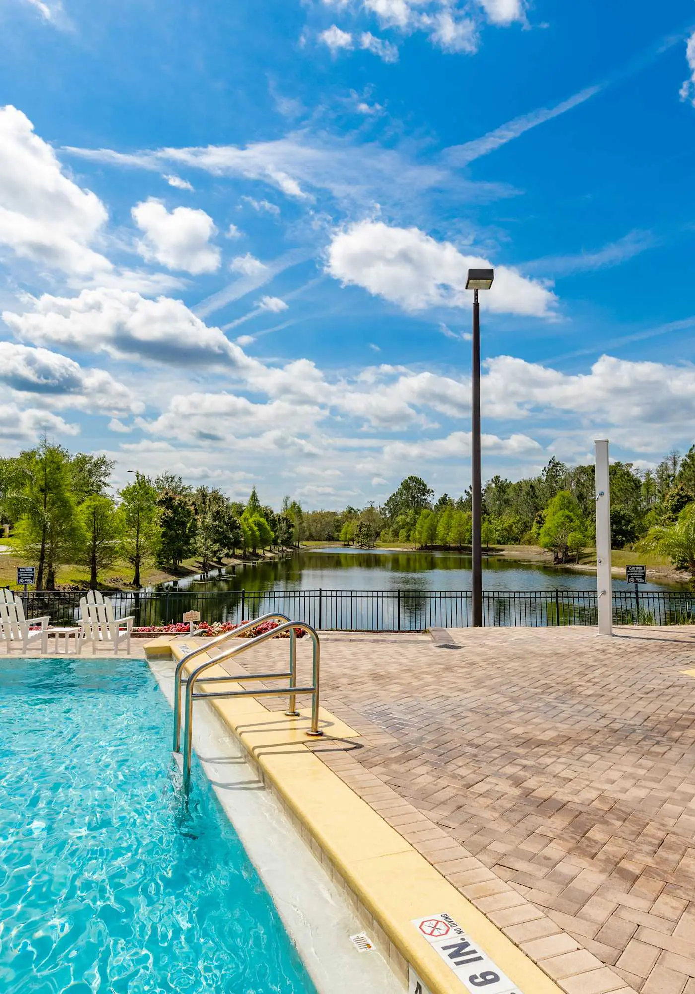 1st floor condo w/ sauna, shared pools, patio, limited-mobility access, gym
