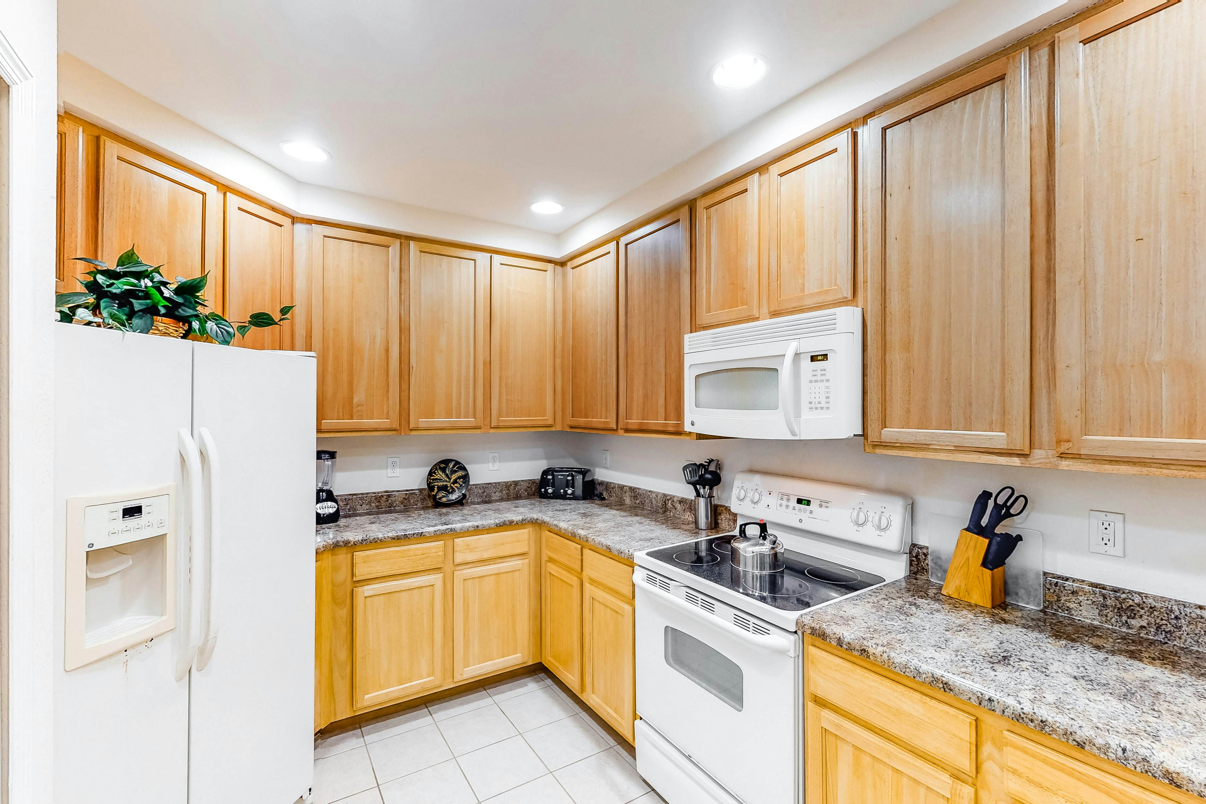 1st floor condo w/ patio, shared pools, gym, limited-mobility access, & sauna