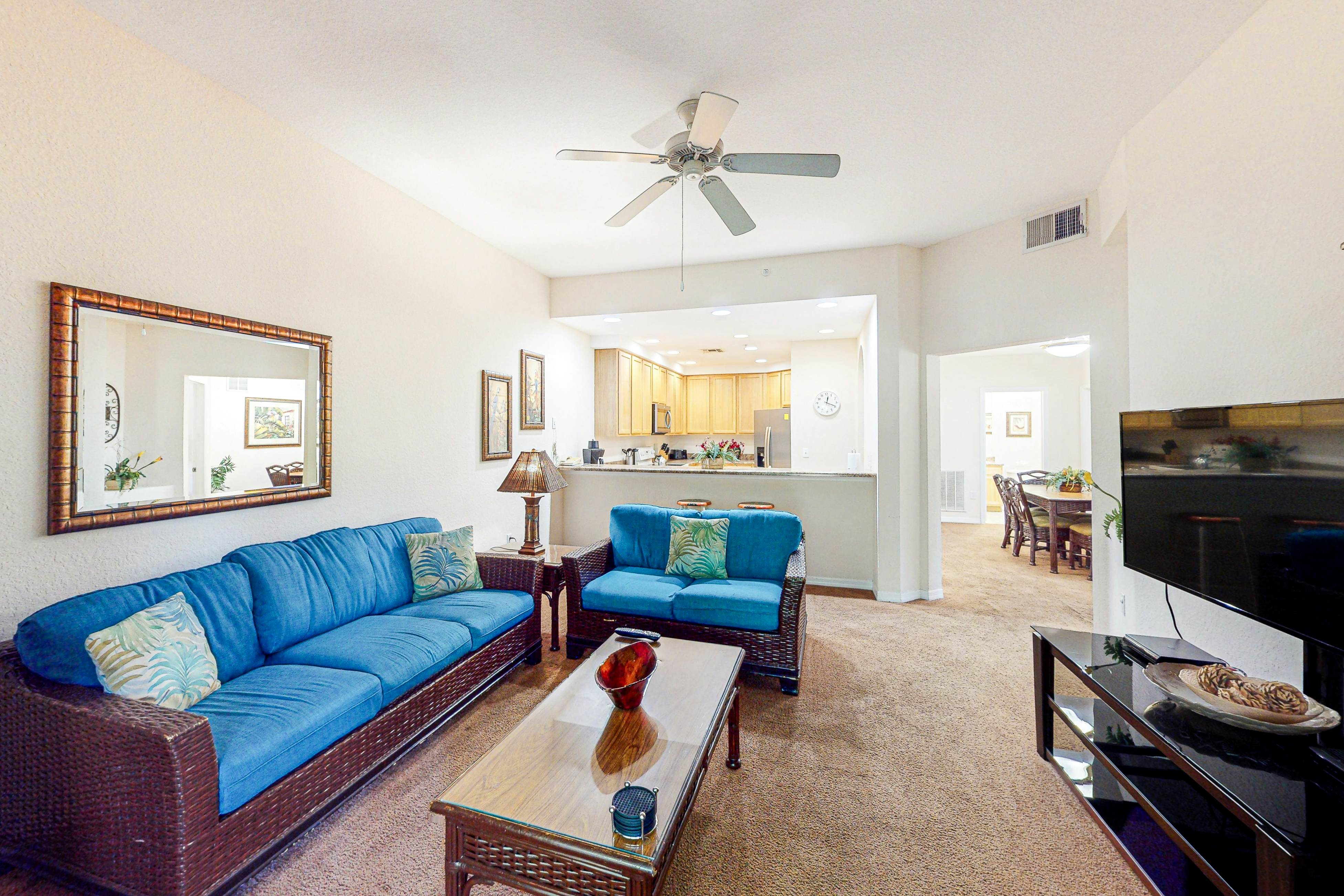 First-floor condo with shared pools, limited-mobility access, sauna, gym, patio