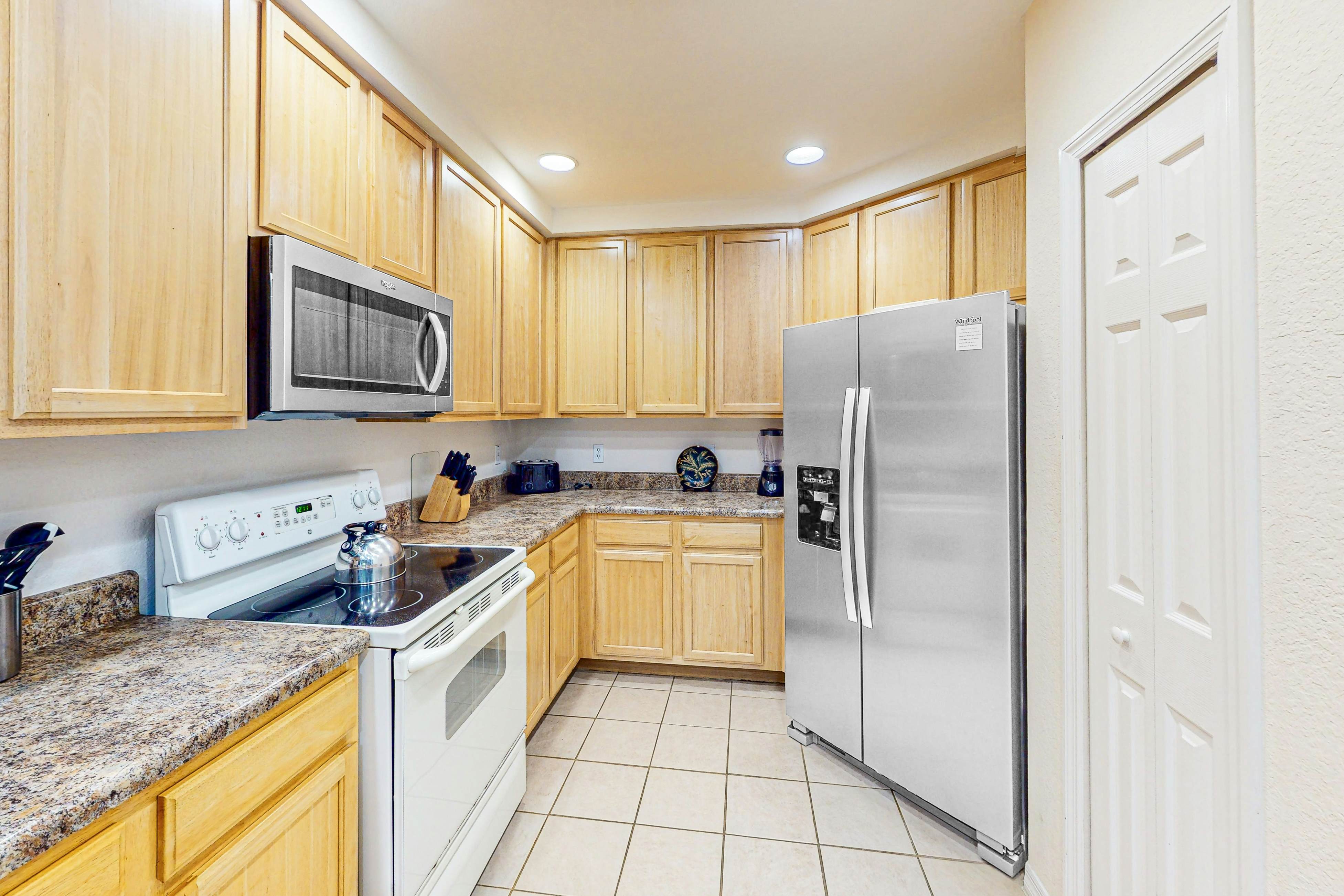 First-floor condo with shared pools, limited-mobility access, sauna, gym, patio