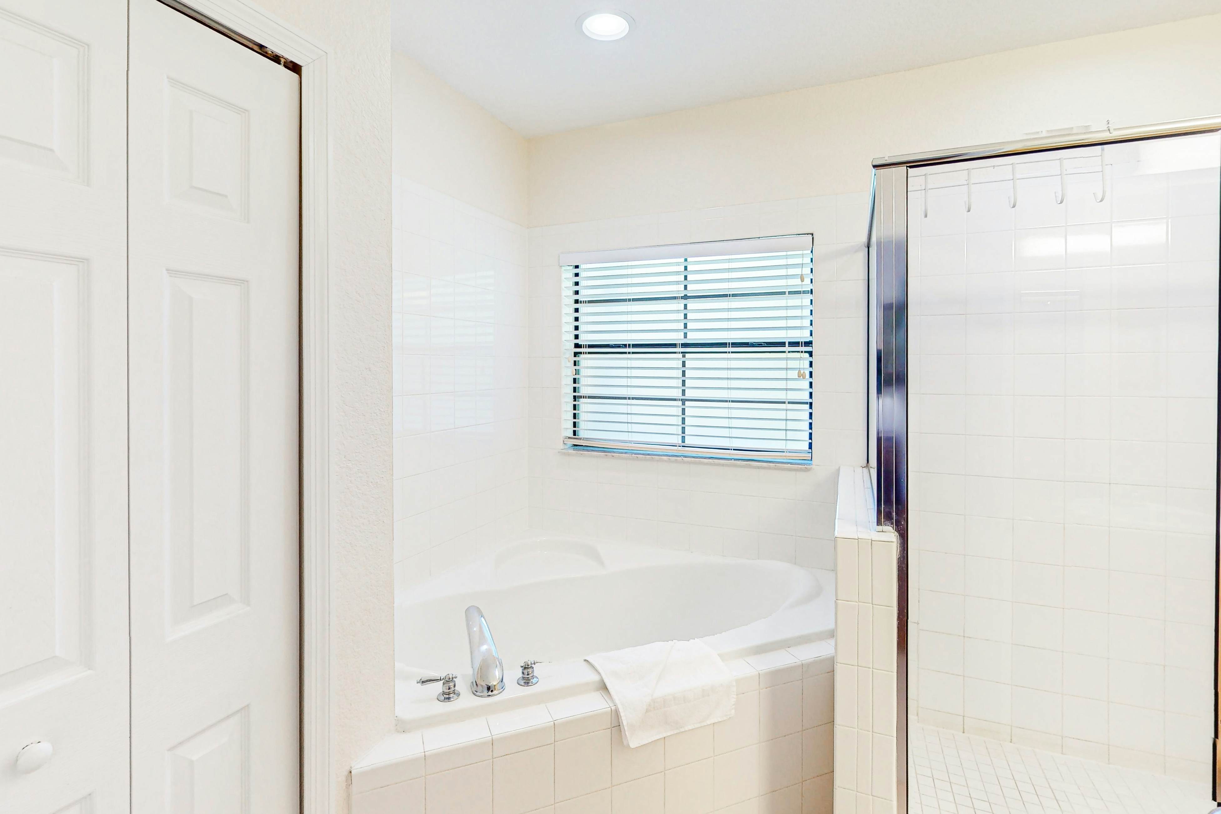 First-floor condo with shared pools, limited-mobility access, sauna, gym, patio