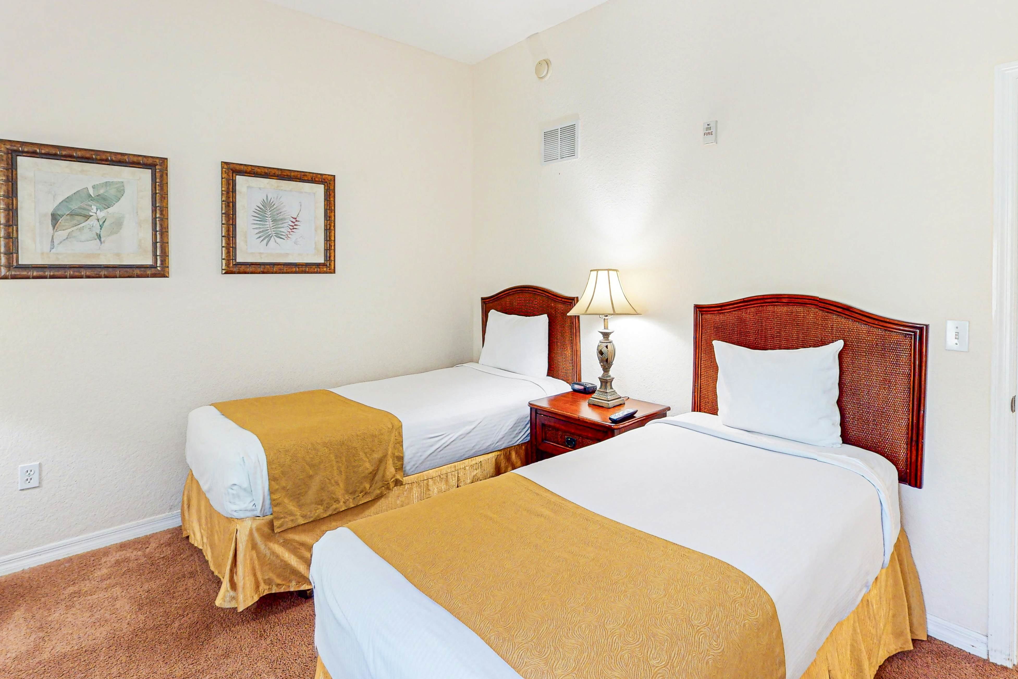 First-floor condo with shared pools, limited-mobility access, sauna, gym, patio