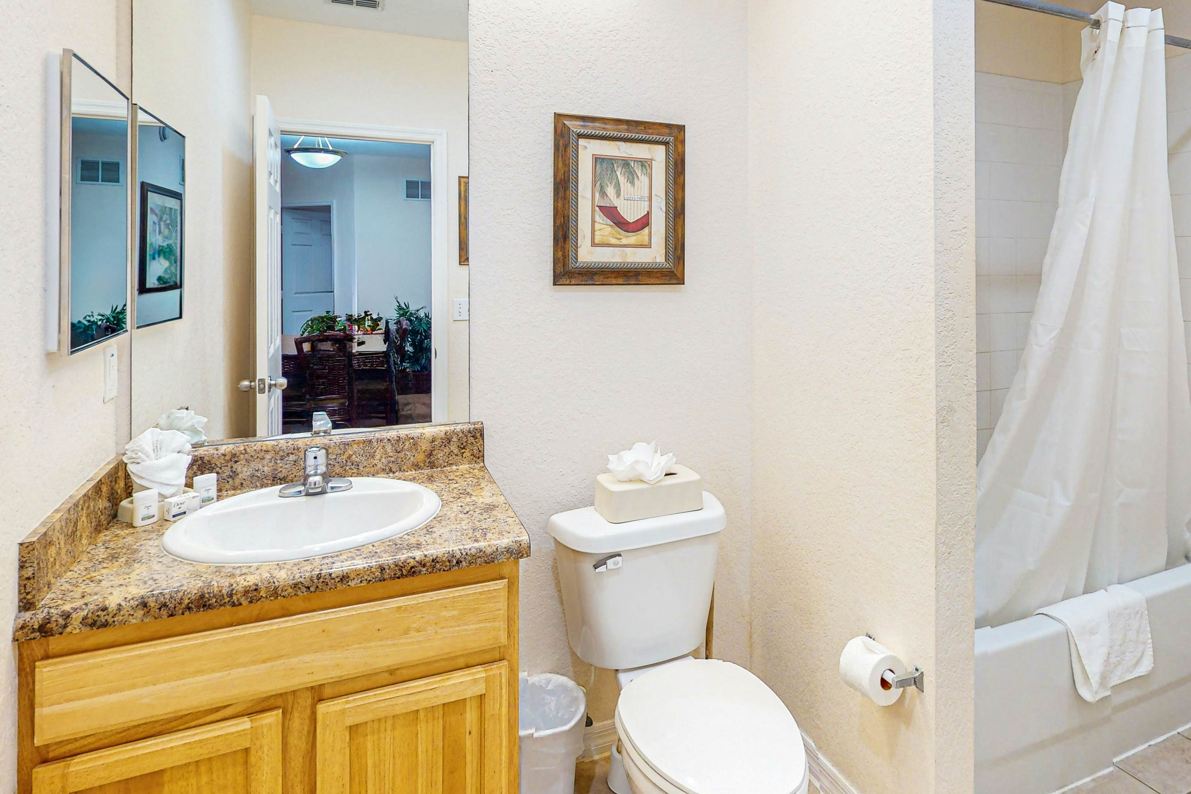 First-floor condo with shared pools, limited-mobility access, sauna, gym, patio