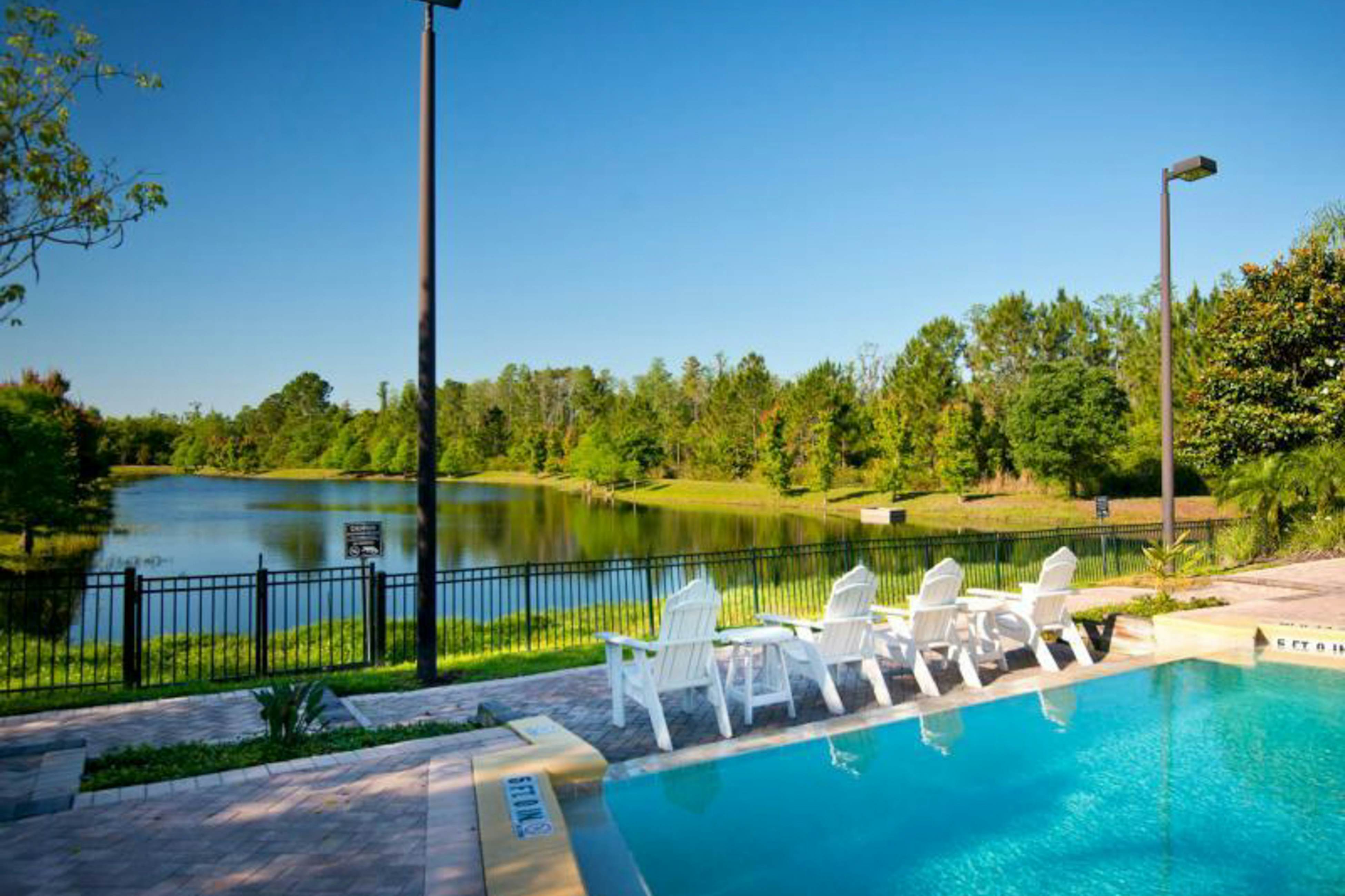 Water view condo with fabulous resort amenities and four TVs - close to Disney 