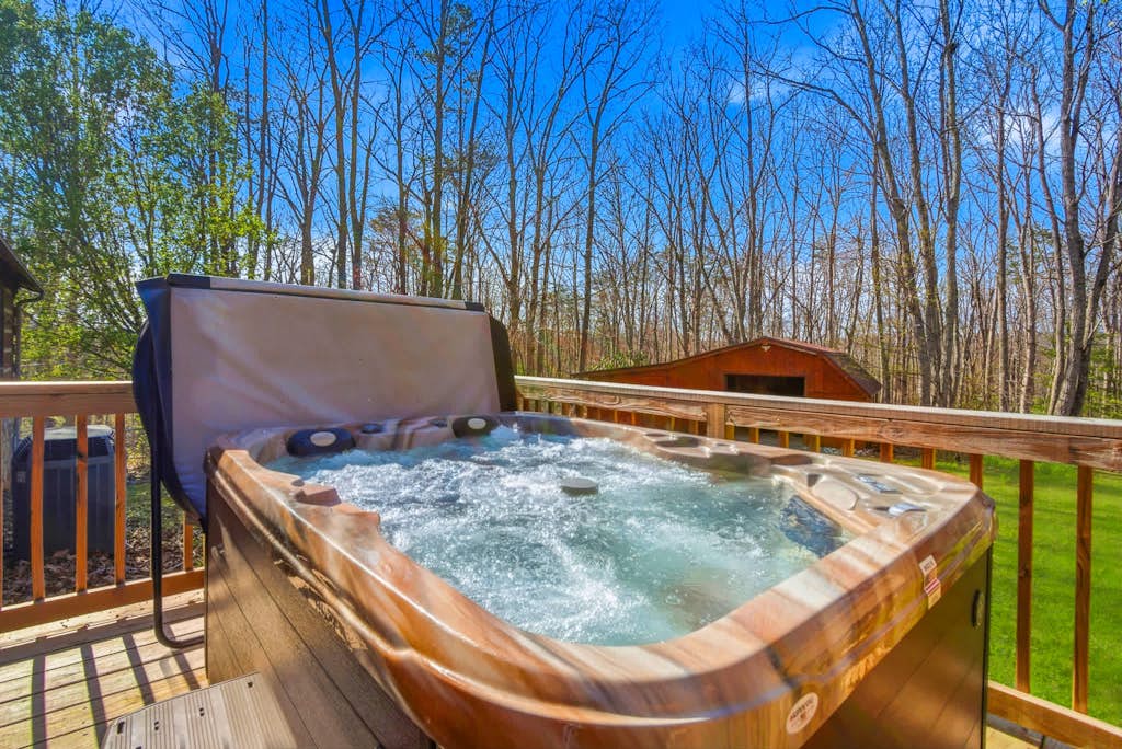 🐻 Welcome to Bear Paw Cove – A True Smoky Mountain Log Cabin Retreat

Experience the best of mountain living at Bear Paw Cove, a charming true log cabin nestled in the heart of Wears Valley 🌄. Perfectly positioned for convenience and adventure, you’ll enjoy easy access to Pigeon Forge, Gatlinburg, and the breathtaking beauty of Great Smoky Mountains National Park 🌲.

From the moment you arrive, you’ll feel the warmth and rustic charm that make this cabin a true Smoky Mountain escape.

🛏️ Comfortable & Spacious Sleeping

The thoughtfully designed floor plan offers space for everyone to relax:

• Two main-level bedrooms, including a spacious primary suite with a King bed 👑
• Spa-style primary bathroom featuring a walk-in shower, rain head 🚿, and soothing body jets
• An open loft with additional sleeping space and a private full bath — perfect for guests who appreciate a little extra privacy

🛋️ Cozy Mountain Living

The main living area welcomes you with warm wood interiors, vaulted ceilings, and a stunning stone fireplace 🔥ideal for cozy evenings after a day of adventure.

The fully equipped kitchen 🍳 flows seamlessly into the dining area, making mealtime easy and enjoyable. An oversized laundry room with a folding station 🧺 adds everyday convenience, especially for extended stays.

Start your mornings in the bright sunroom ☀️ with a peaceful cup of coffee, or head to the game room 🎱 for indoor fun the whole family will love.

🌲 Outdoor Relaxation

Step outside to your private deck and soak in the hot tub ♨️ while enjoying the fresh mountain air. The fenced backyard offers added privacy, and the fire pit 🔥 is perfect for gathering under the stars and sharing stories after sunset ✨.

Whether you’re planning a family getaway, couples retreat, or Smoky Mountain adventure, Bear Paw Cove offers the perfect blend of rustic charm, modern comfort, and unbeatable location. 🏔️