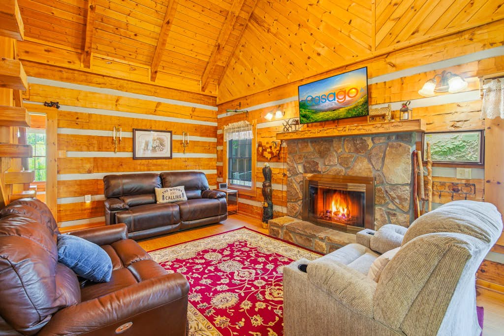 🐻 Welcome to Bear Paw Cove – A True Smoky Mountain Log Cabin Retreat

Experience the best of mountain living at Bear Paw Cove, a charming true log cabin nestled in the heart of Wears Valley 🌄. Perfectly positioned for convenience and adventure, you’ll enjoy easy access to Pigeon Forge, Gatlinburg, and the breathtaking beauty of Great Smoky Mountains National Park 🌲.

From the moment you arrive, you’ll feel the warmth and rustic charm that make this cabin a true Smoky Mountain escape.

🛏️ Comfortable & Spacious Sleeping

The thoughtfully designed floor plan offers space for everyone to relax:

• Two main-level bedrooms, including a spacious primary suite with a King bed 👑
• Spa-style primary bathroom featuring a walk-in shower, rain head 🚿, and soothing body jets
• An open loft with additional sleeping space and a private full bath — perfect for guests who appreciate a little extra privacy

🛋️ Cozy Mountain Living

The main living area welcomes you with warm wood interiors, vaulted ceilings, and a stunning stone fireplace 🔥ideal for cozy evenings after a day of adventure.

The fully equipped kitchen 🍳 flows seamlessly into the dining area, making mealtime easy and enjoyable. An oversized laundry room with a folding station 🧺 adds everyday convenience, especially for extended stays.

Start your mornings in the bright sunroom ☀️ with a peaceful cup of coffee, or head to the game room 🎱 for indoor fun the whole family will love.

🌲 Outdoor Relaxation

Step outside to your private deck and soak in the hot tub ♨️ while enjoying the fresh mountain air. The fenced backyard offers added privacy, and the fire pit 🔥 is perfect for gathering under the stars and sharing stories after sunset ✨.

Whether you’re planning a family getaway, couples retreat, or Smoky Mountain adventure, Bear Paw Cove offers the perfect blend of rustic charm, modern comfort, and unbeatable location. 🏔️