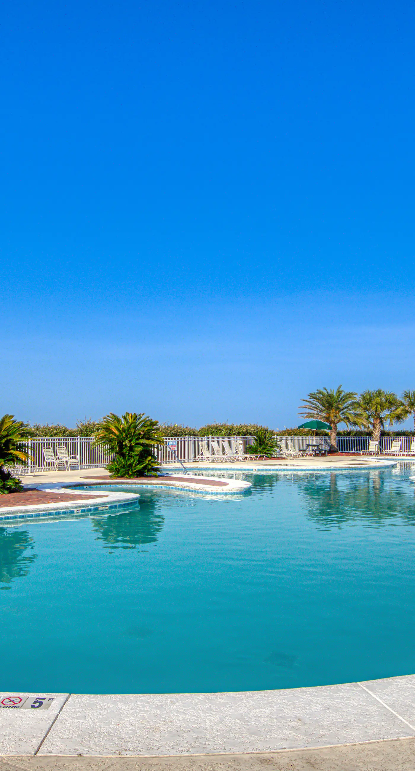 Ocean-view condo near the beach with indoor pool, gym, & basketball