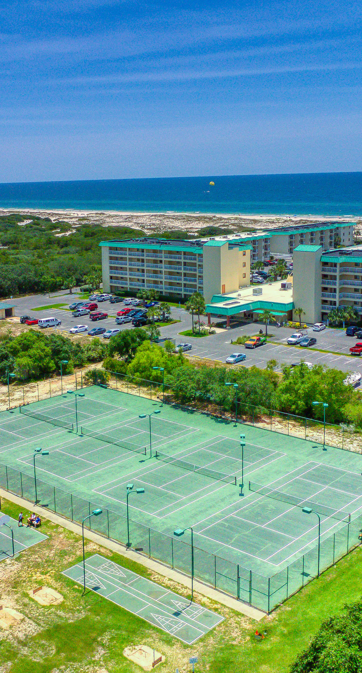 Ocean-view condo near the beach with indoor pool, gym, & basketball