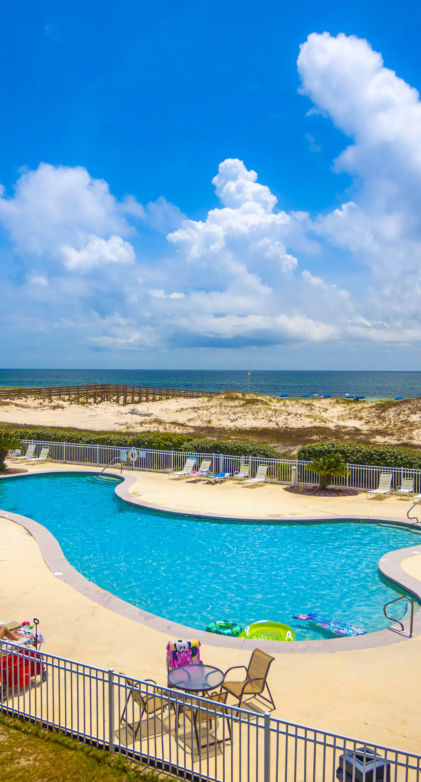 Waterfront getaway with beach view, shared pools & sports courts