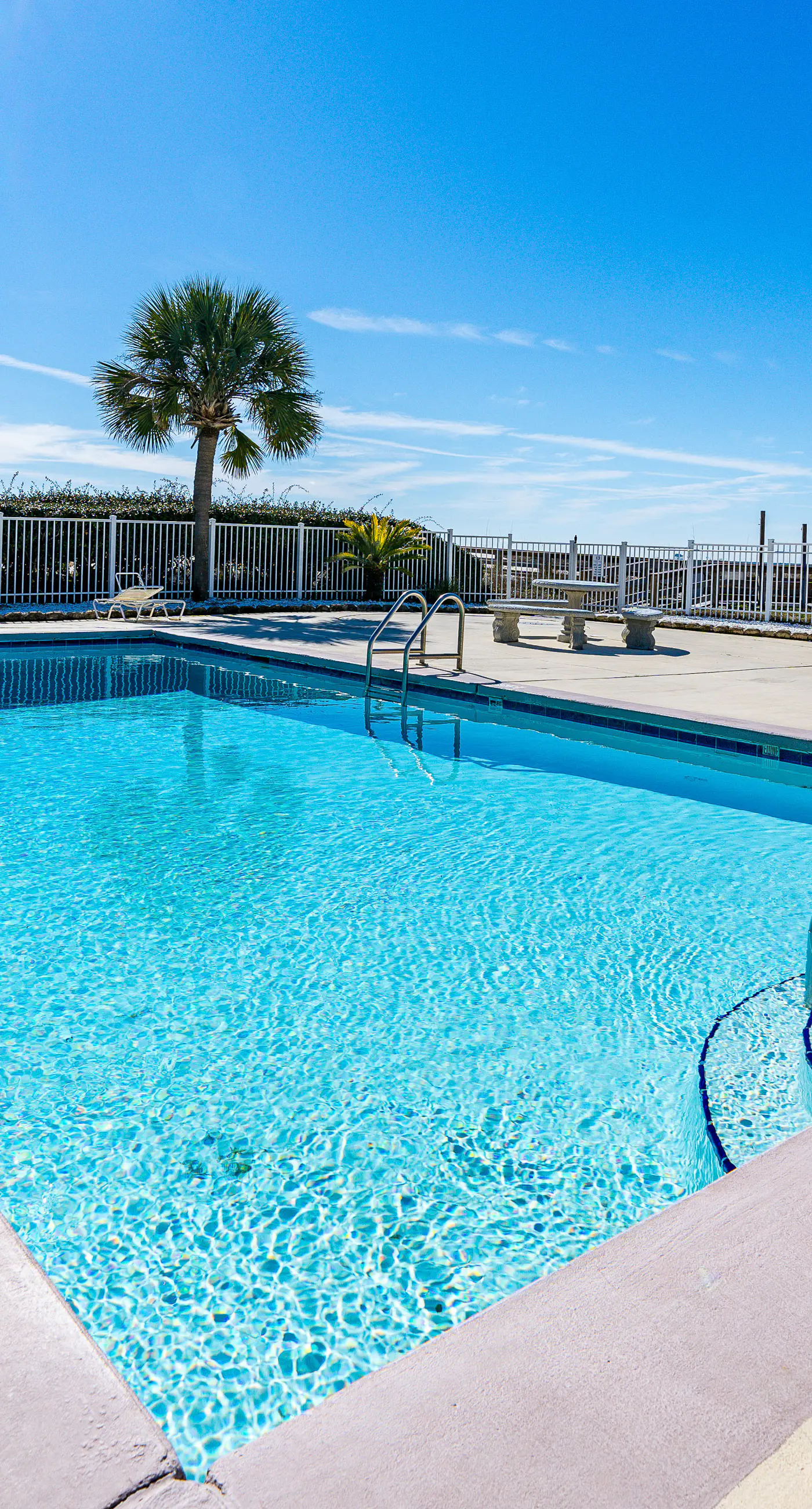 Beachfront condo with balcony, shared pool