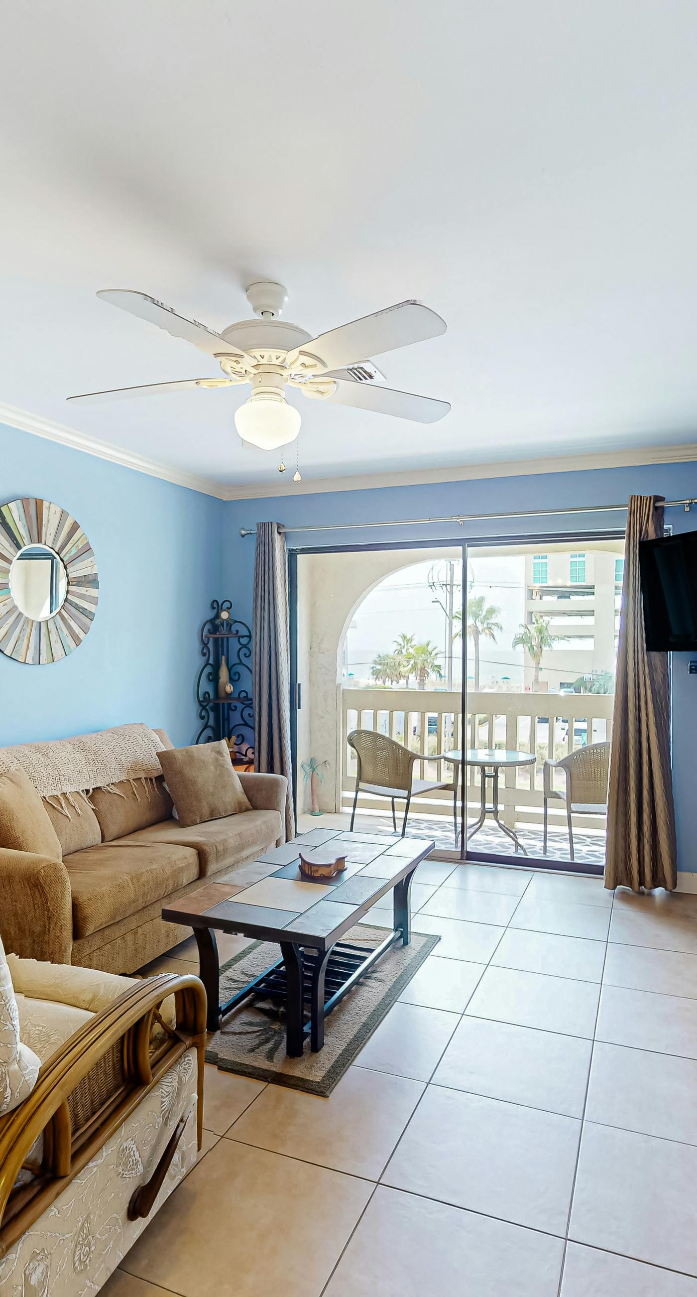 2nd-floor condo near the beach with balcony, outdoor pool, partial beach views