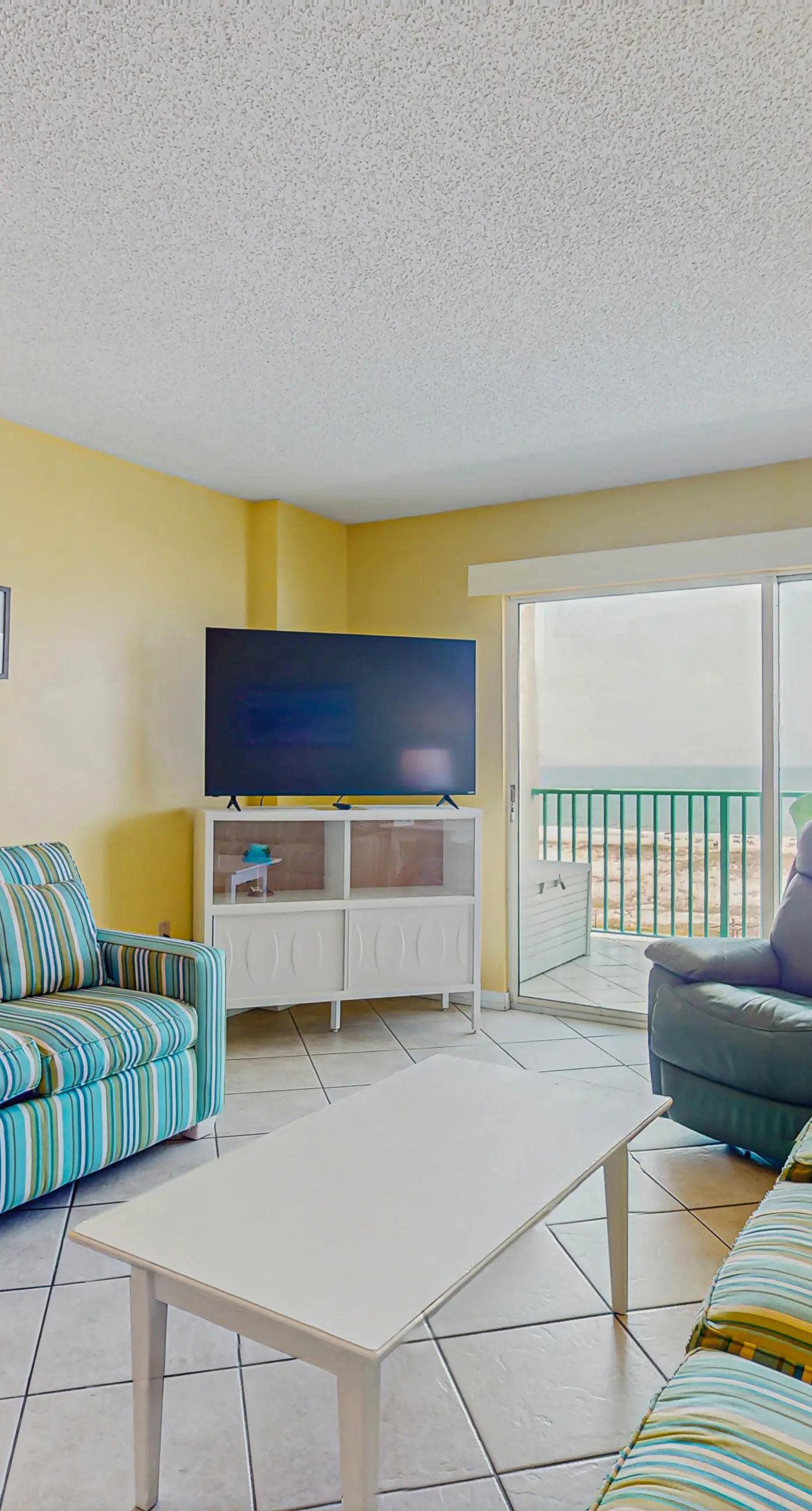 Beachfront condo with balcony, Gulf views, pools, gym, & game room at Plantation Palms