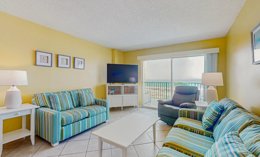 Beachfront condo with balcony, Gulf views, pools, gym, & game room at Plantation Palms