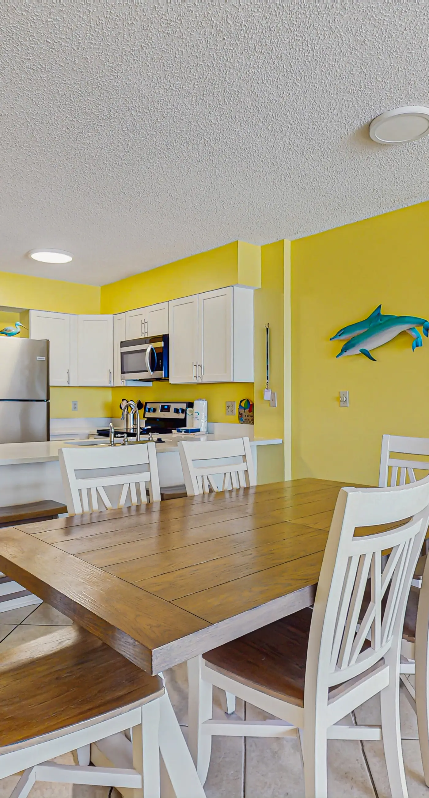 Beachfront condo with balcony, Gulf views, pools, gym, & game room at Plantation Palms