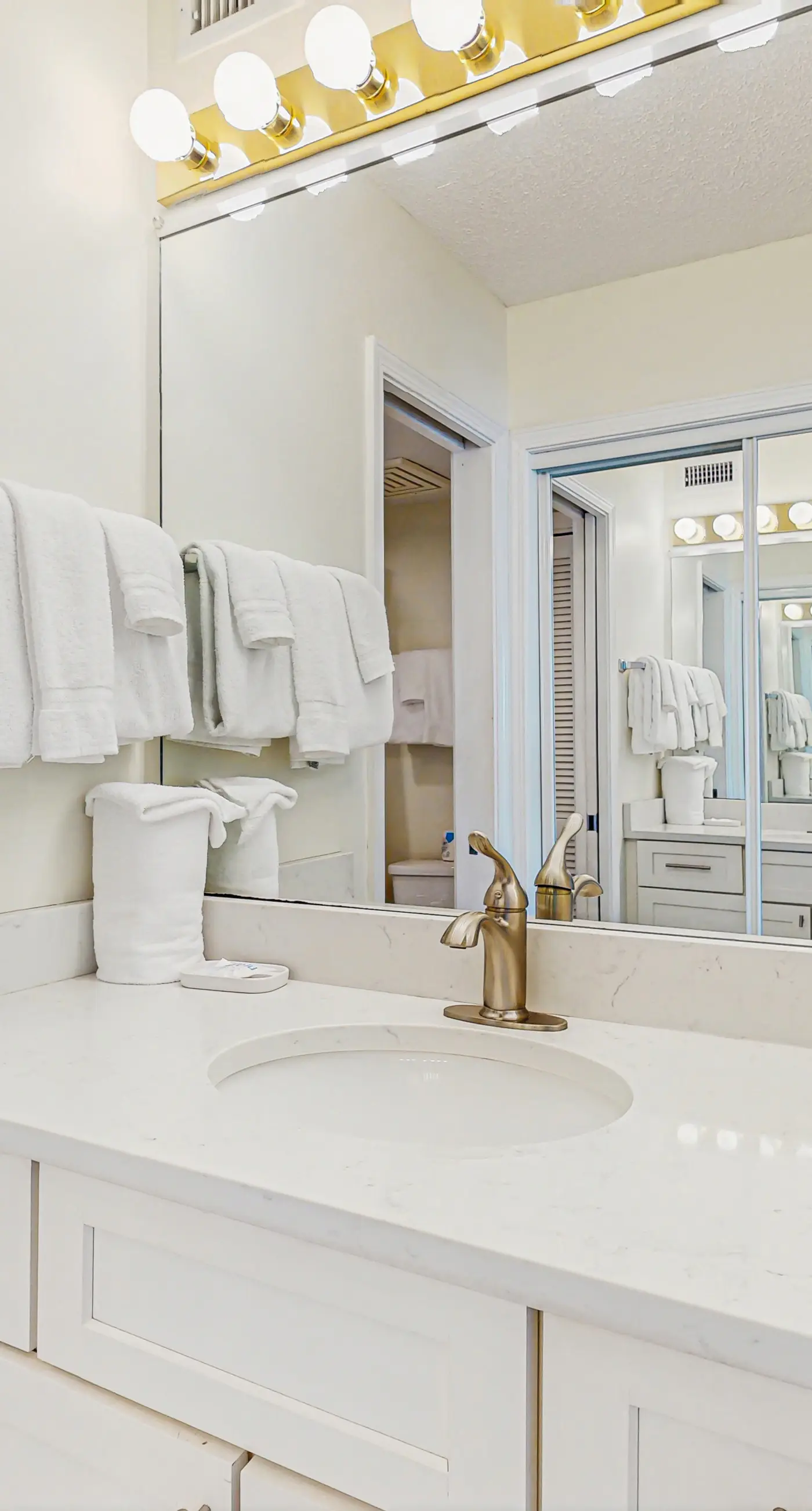 Beachfront condo with balcony, Gulf views, pools, gym, & game room at Plantation Palms