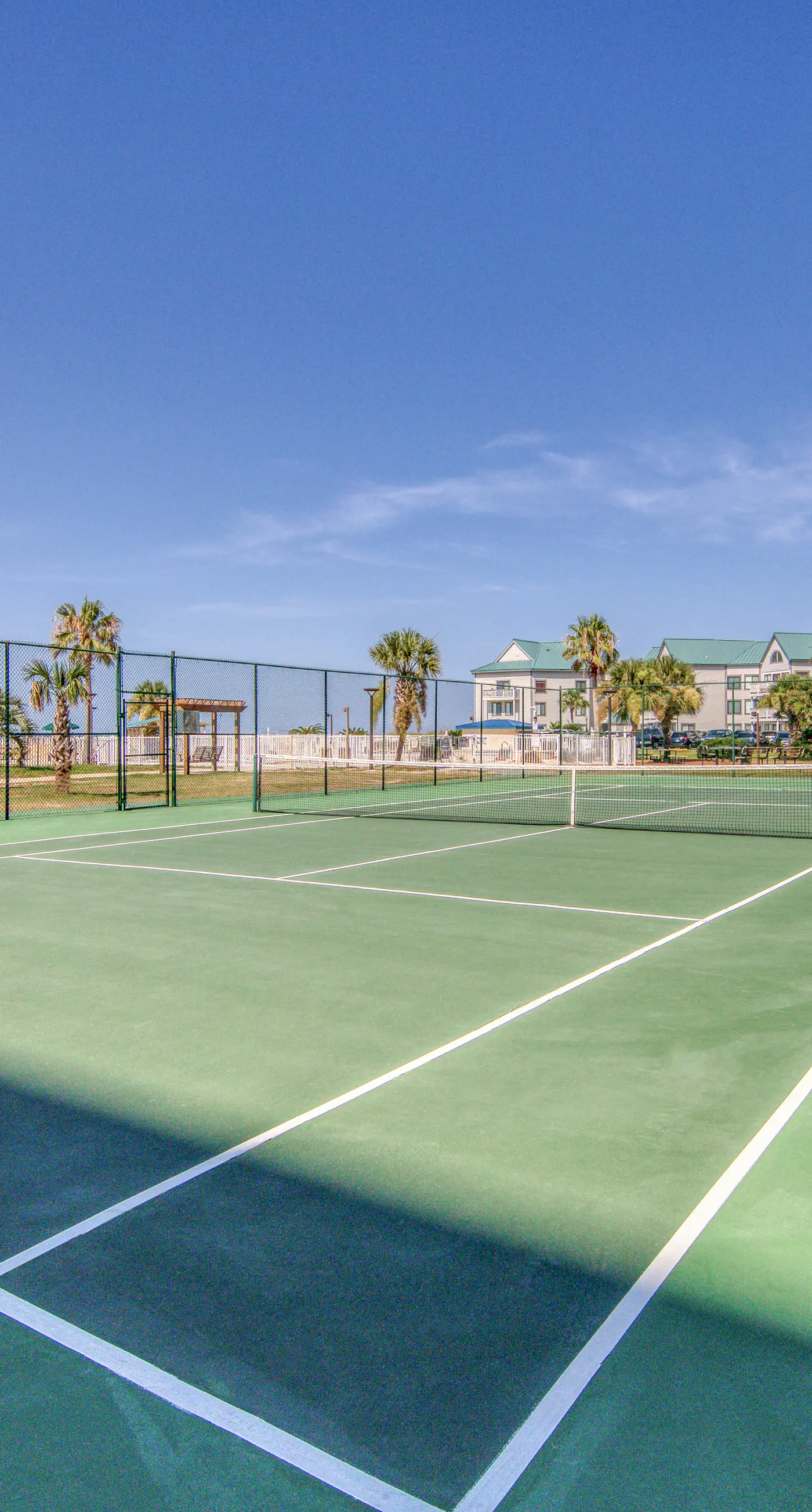 Beachfront condo with balcony, Gulf views, pools, gym, & game room at Plantation Palms