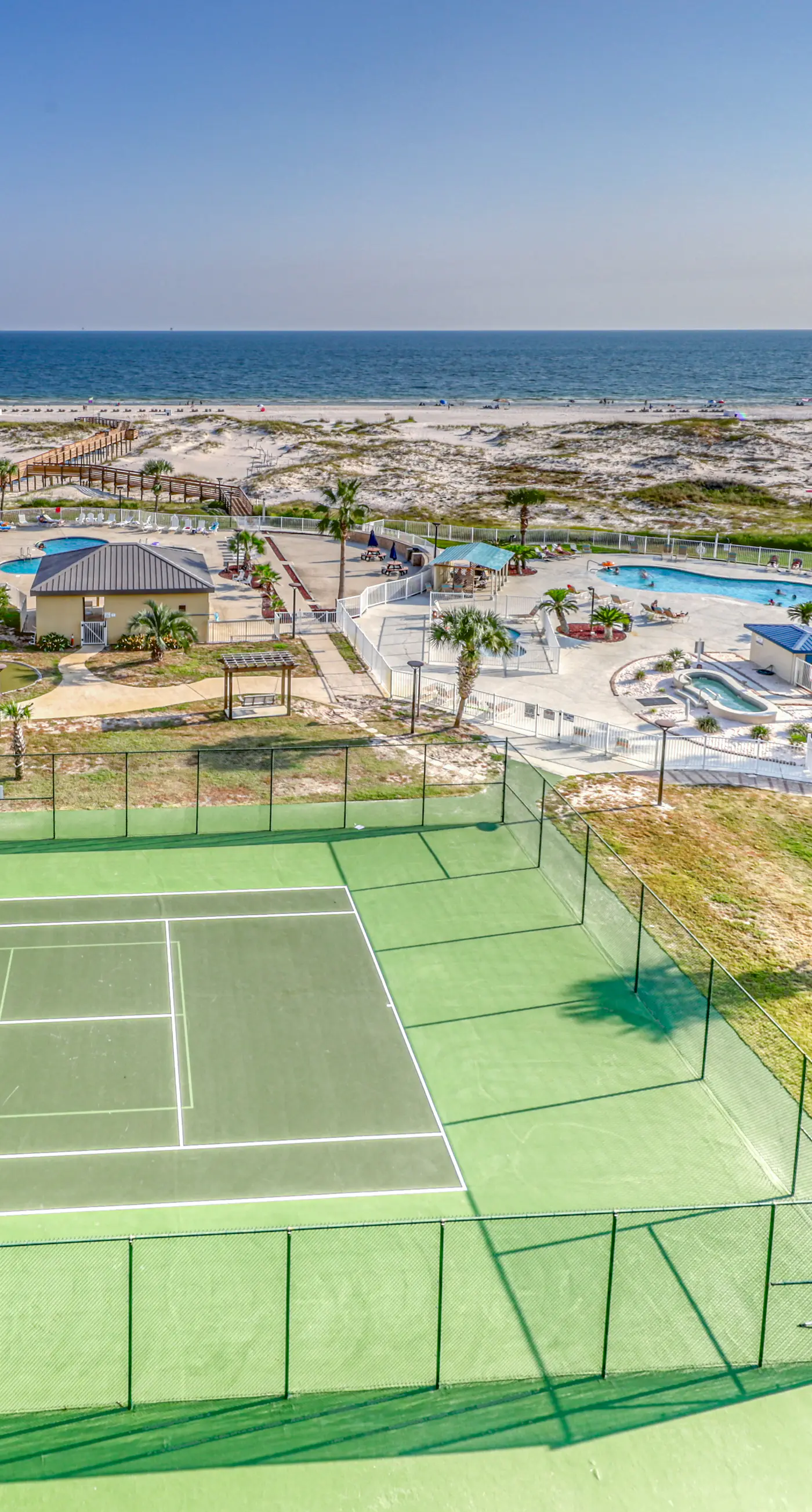 Beachfront condo with balcony, Gulf views, pools, gym, & game room at Plantation Palms