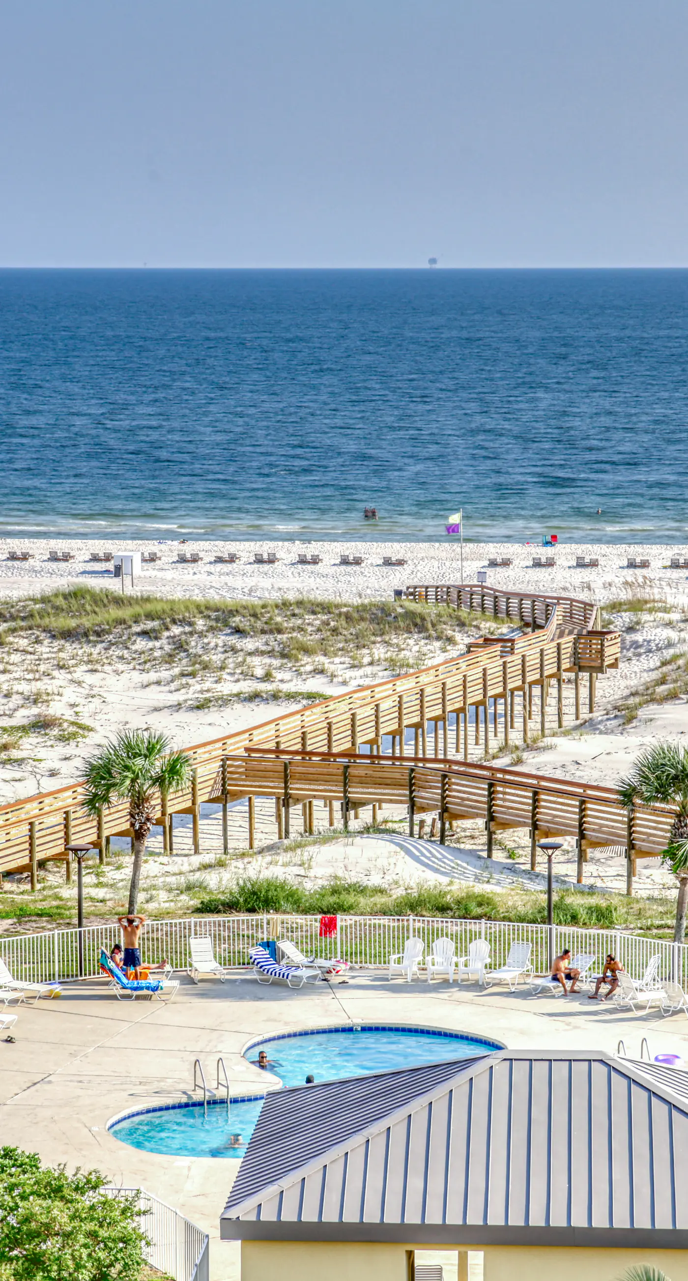 Beachfront condo with balcony, Gulf views, pools, gym, & game room at Plantation Palms