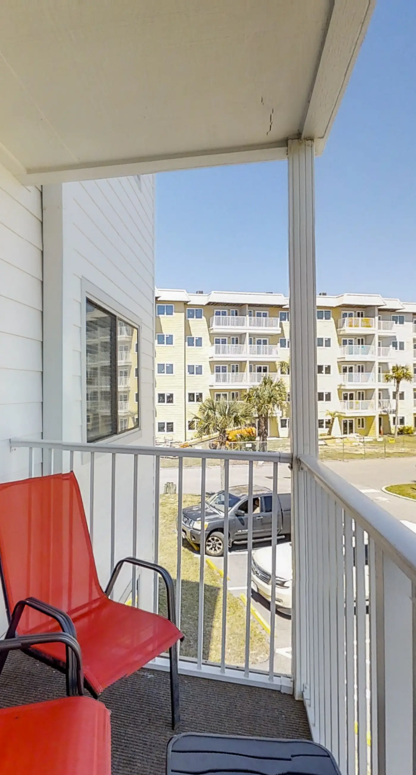 Condo Steps from the Sand with Balcony, Resort Pools, Central AC, & WiFi