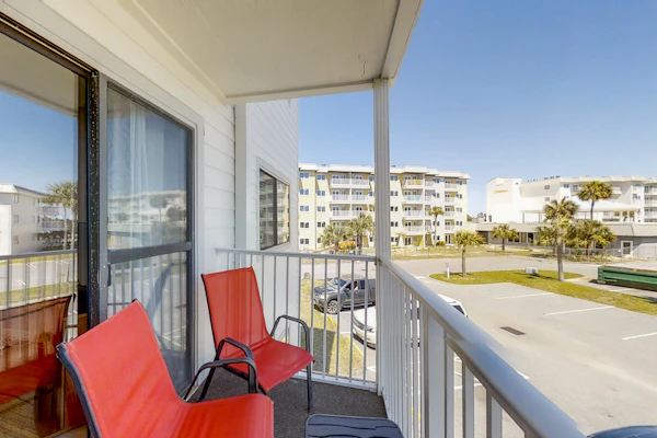 Condo Steps from the Sand with Balcony, Resort Pools, Central AC, & WiFi