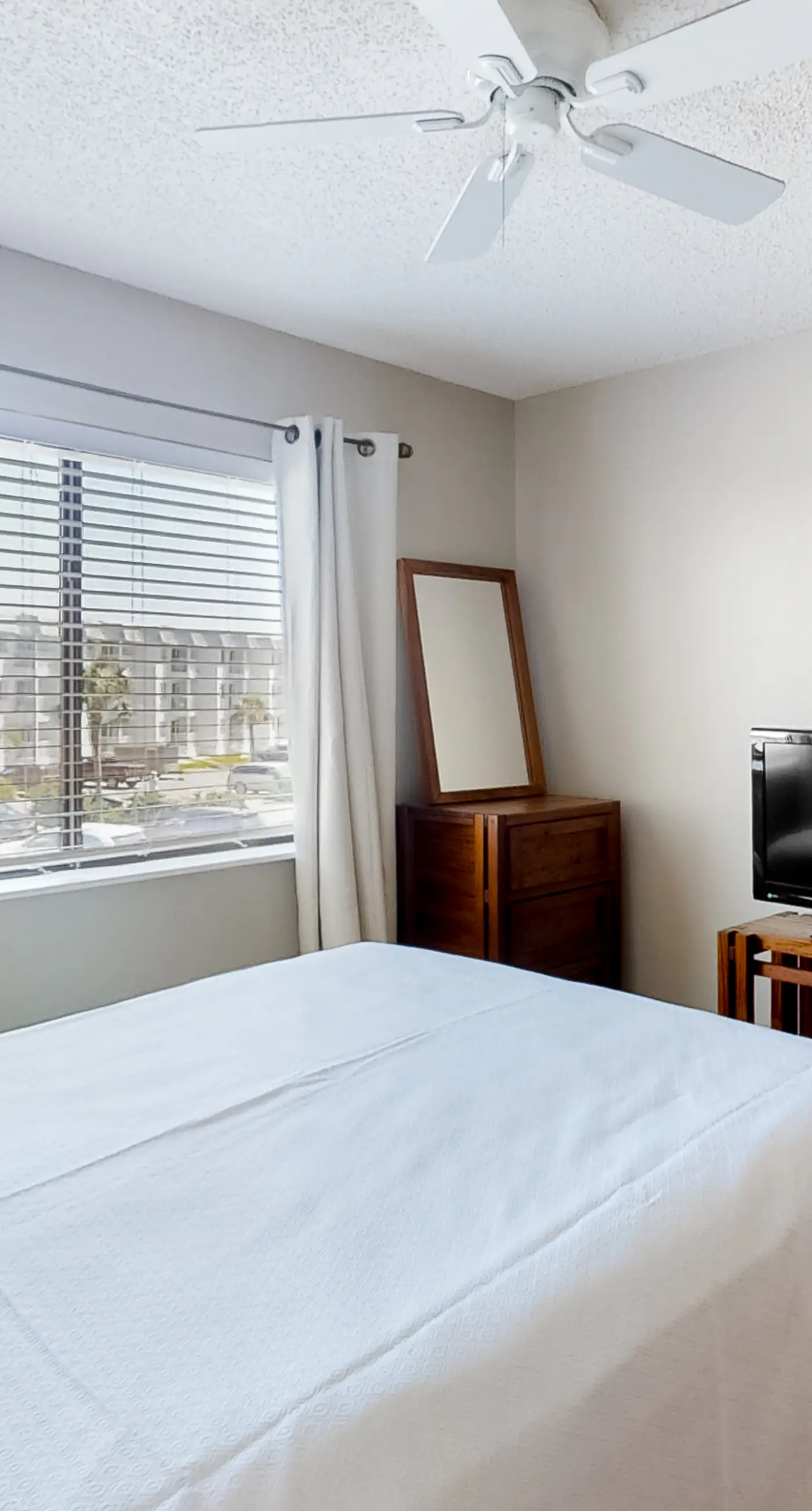 Condo Steps from the Sand with Balcony, Resort Pools, Central AC, & WiFi