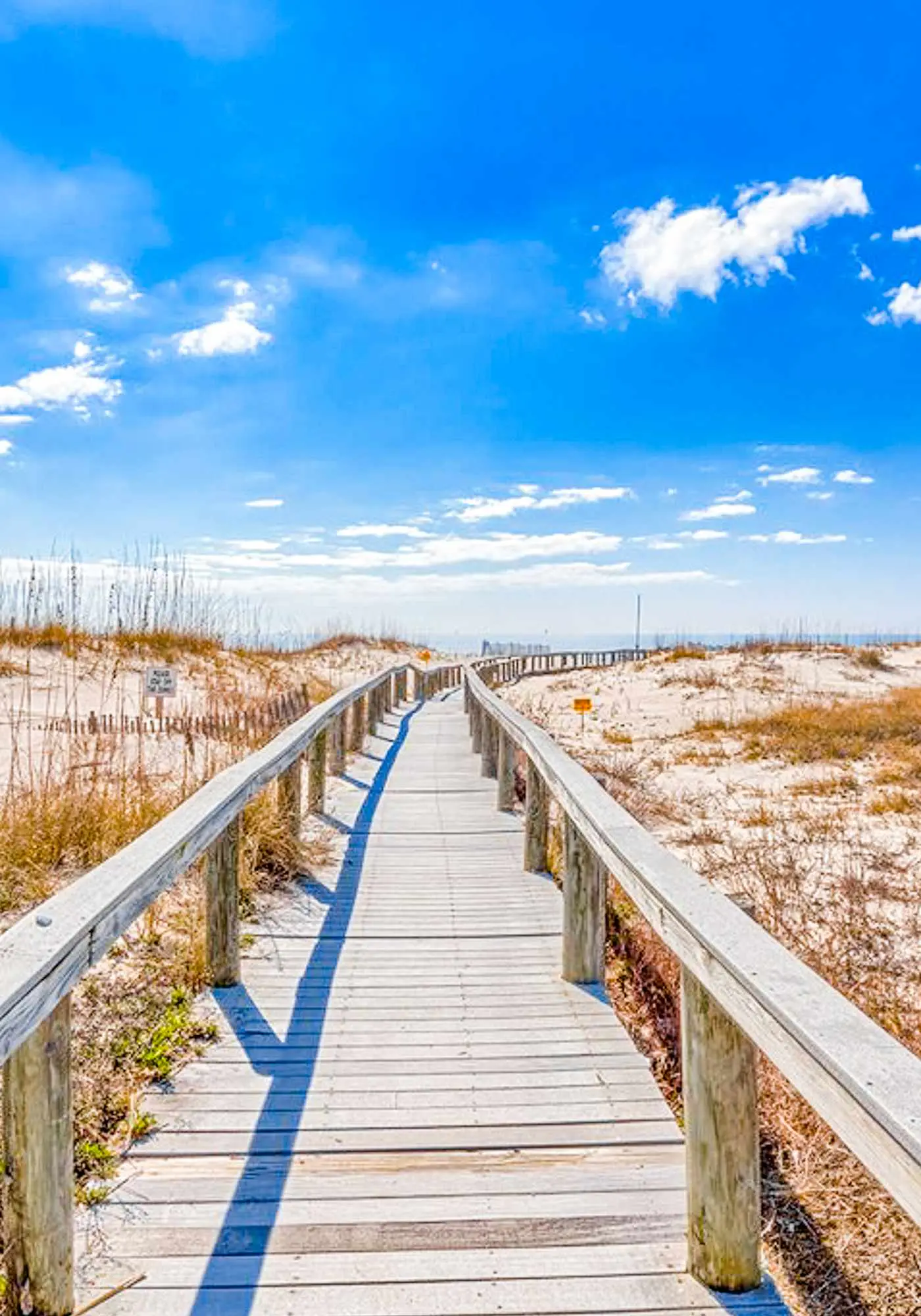Bright corner condo steps from the beach with pools, hot tubs & tennis