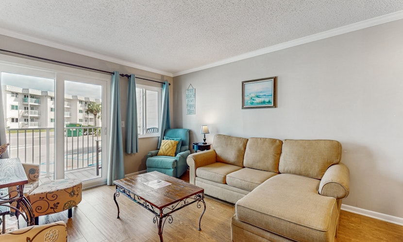 Spacious condo with balcony and shared pools and tennis, on-site golfing