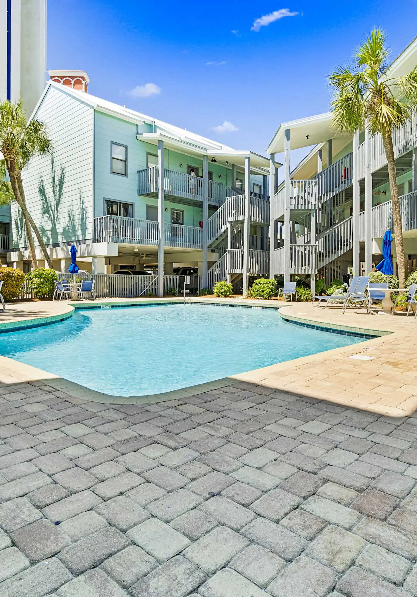 Stunning water-view condo with pool - steps away from the beach