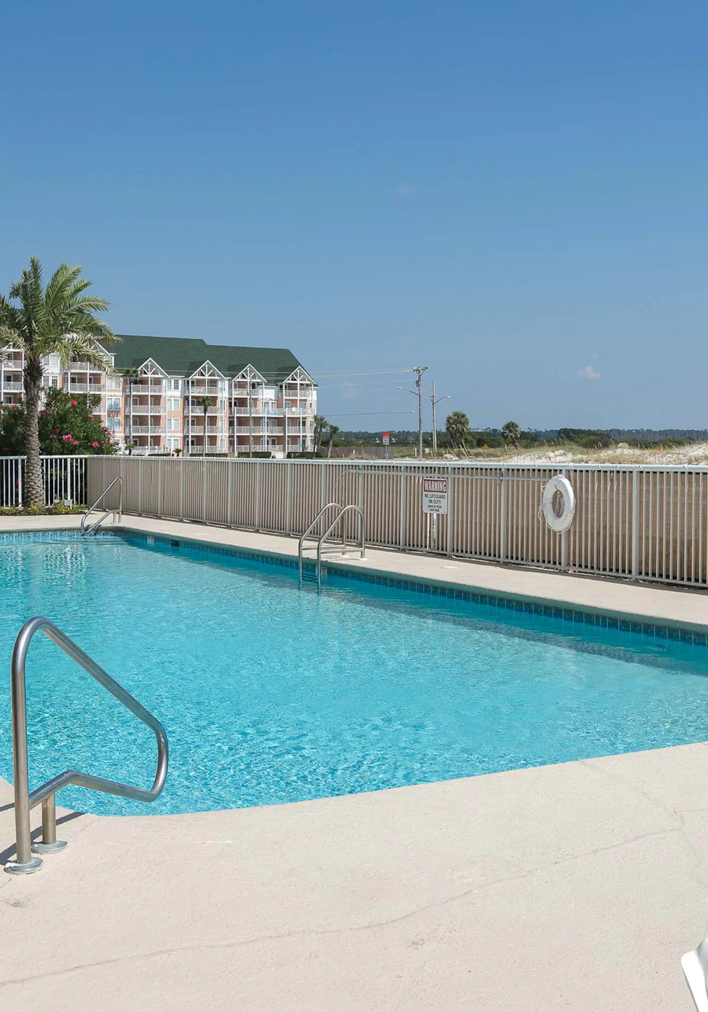 Gulf front condo with community outdoor and indoor pools, hot tub, and sauna