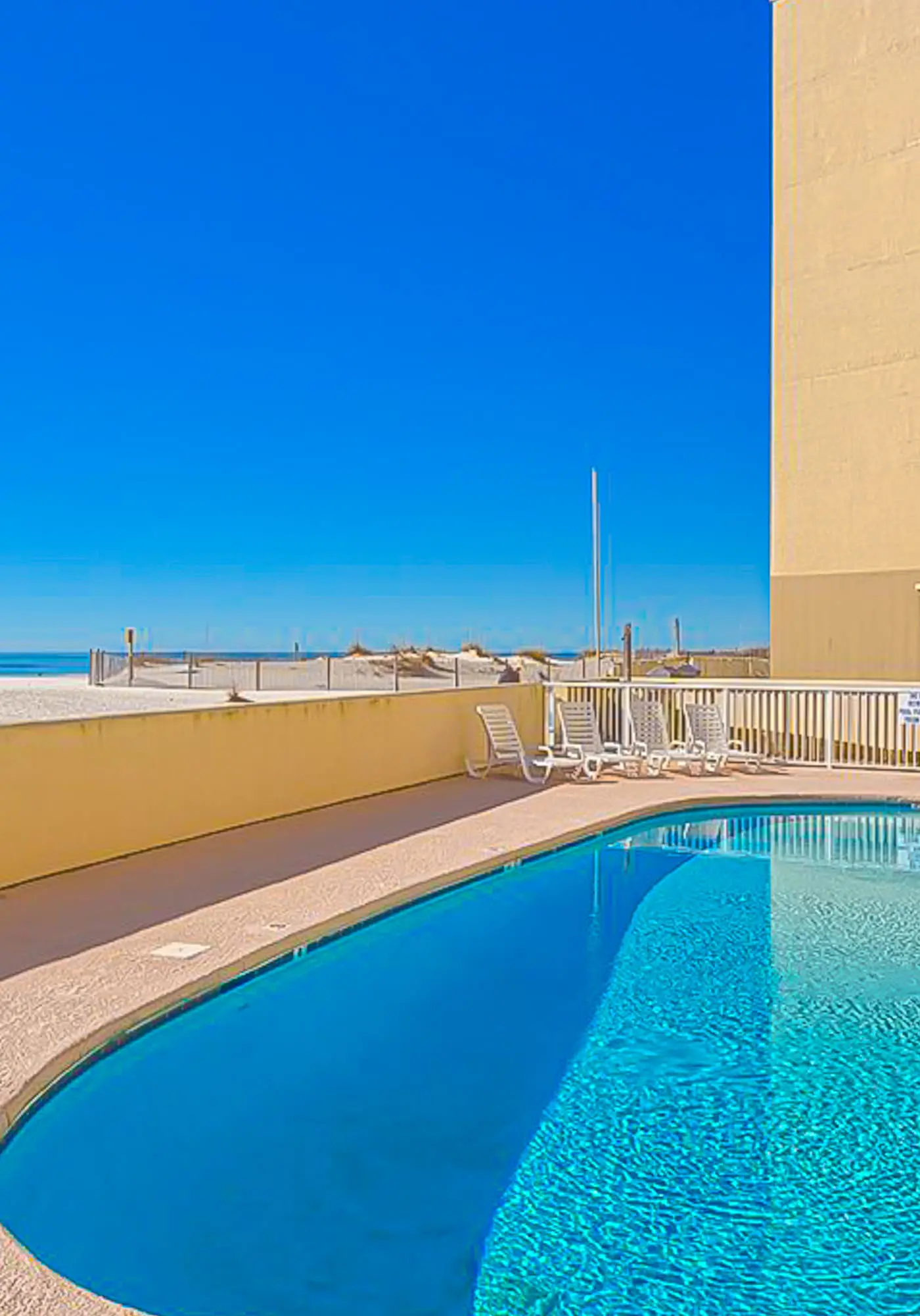 Gulf-front 5th-floor condo with balcony, pool & beach access - snowbird-friendly