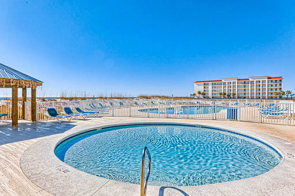 Top-floor beachfront condo with Gulf-view balcony, pool & beach access