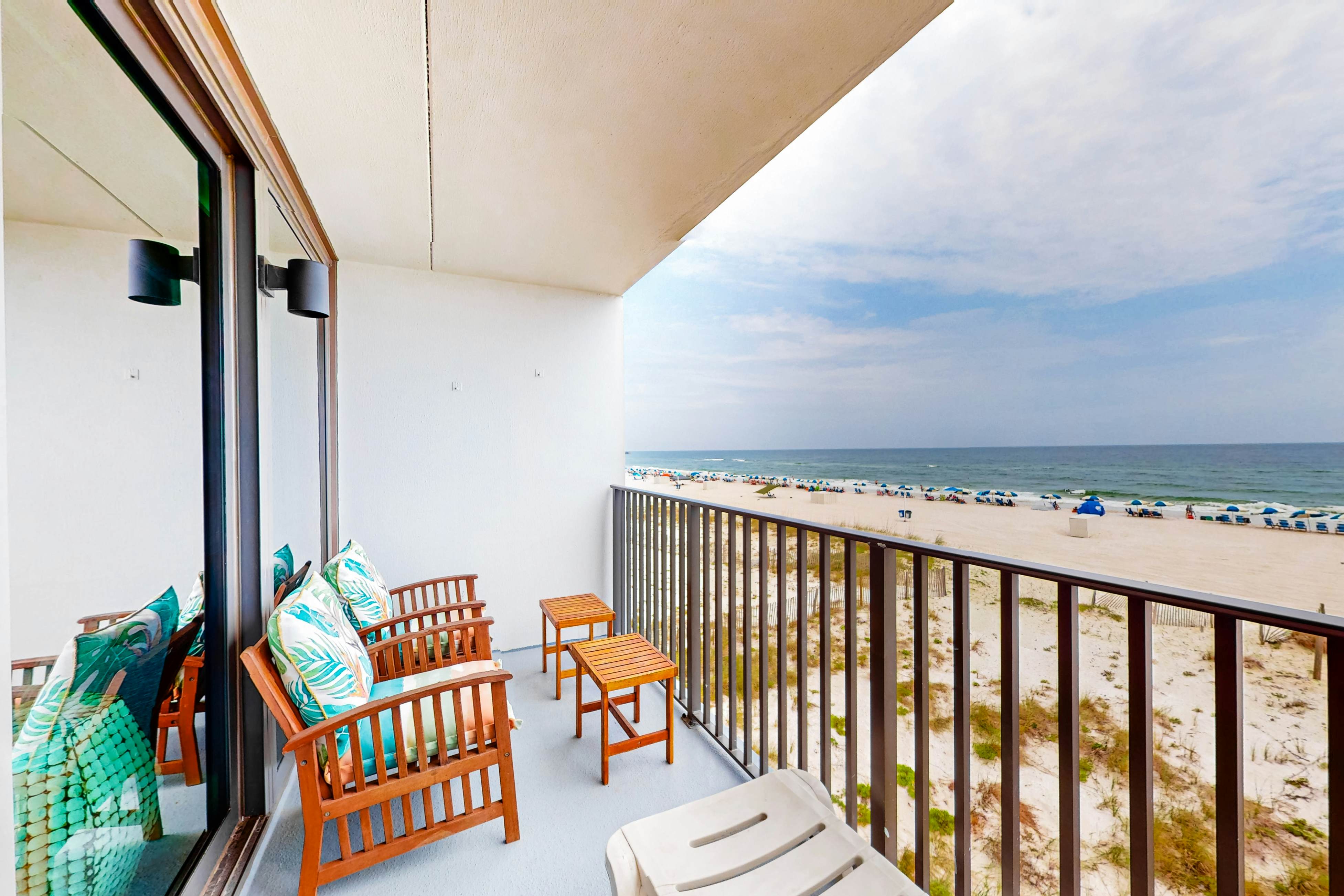 Gulf-front condo with balcony, pool, central AC, & grill