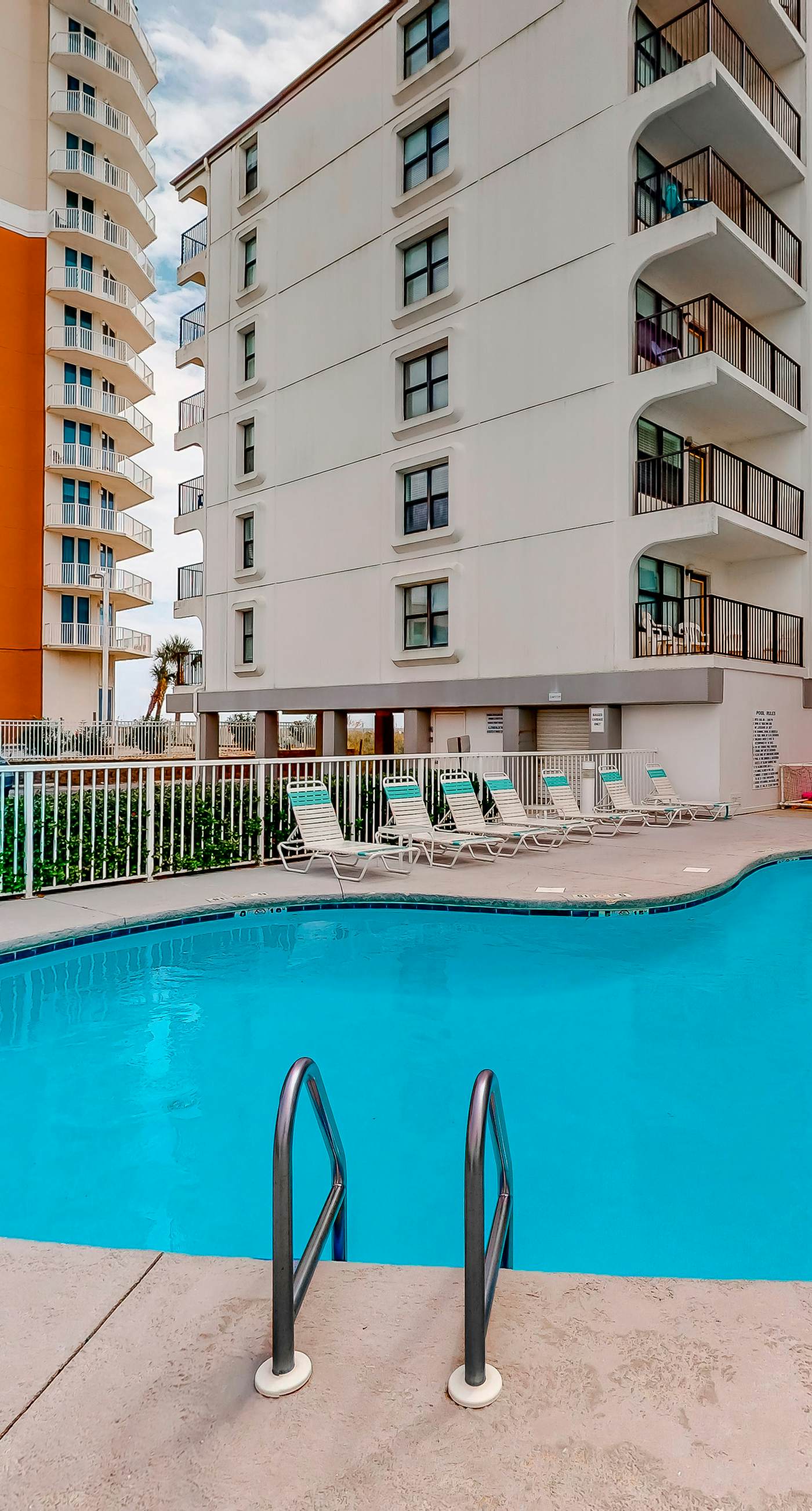 Gulf-front condo with balcony, pool, central AC, & grill