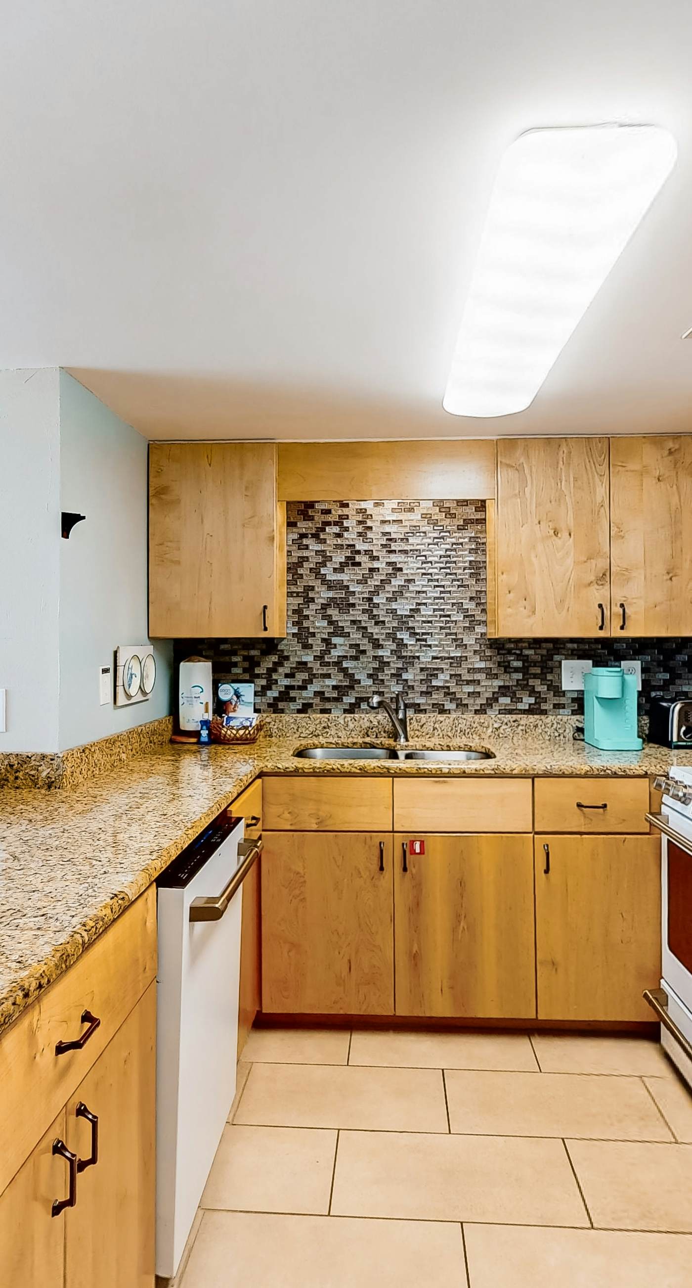 Gulf-front condo with balcony, pool, central AC, & grill