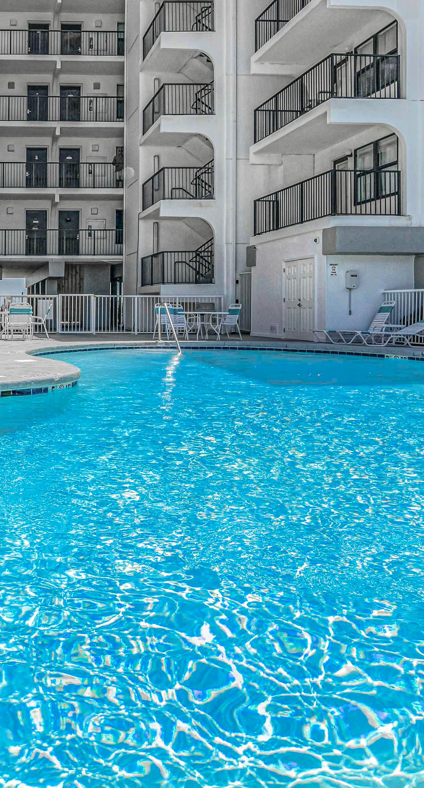 Gulf-front condo with balcony, pool, central AC, & grill