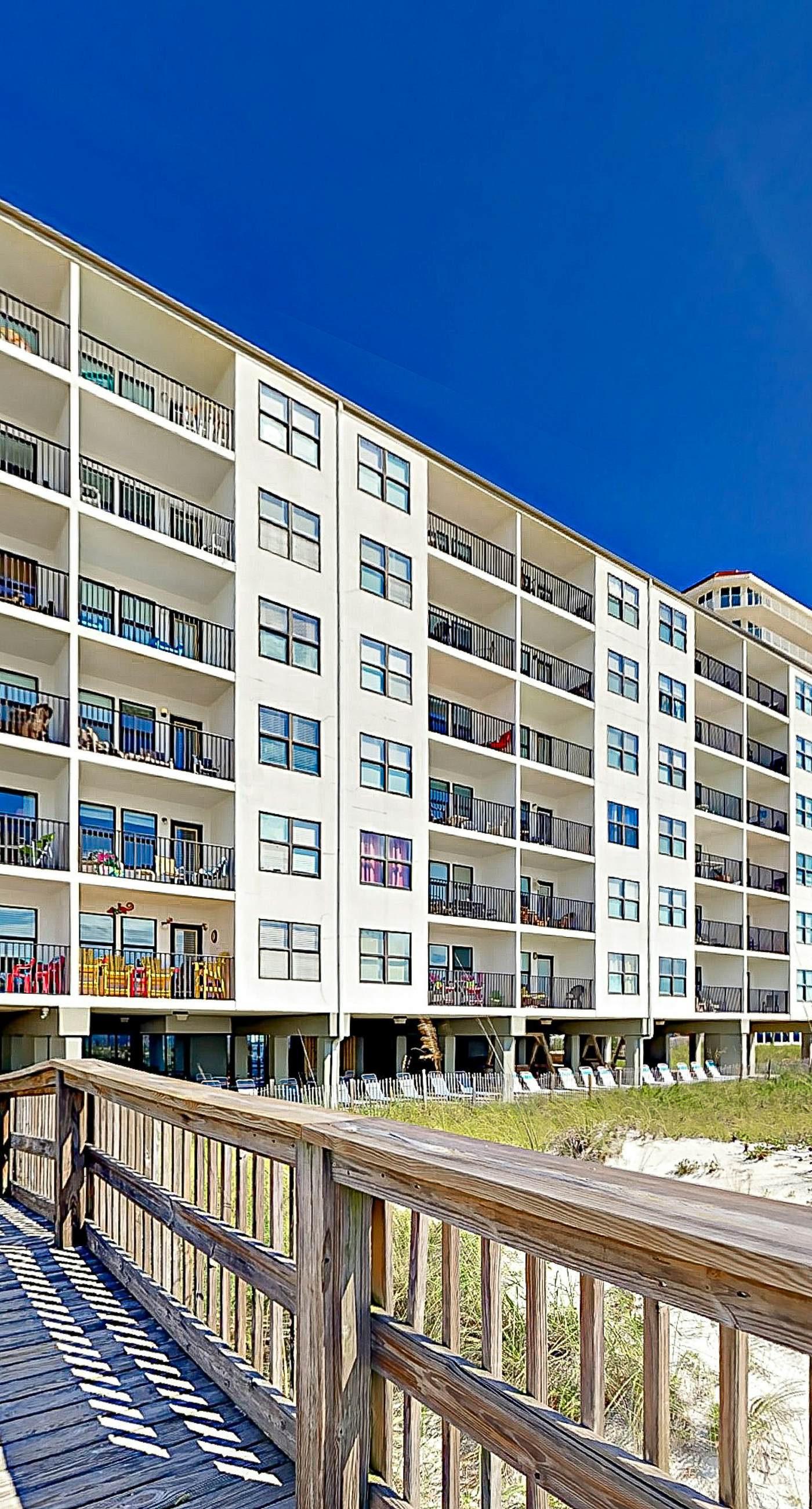 Gulf-front condo with balcony, pool, central AC, & grill