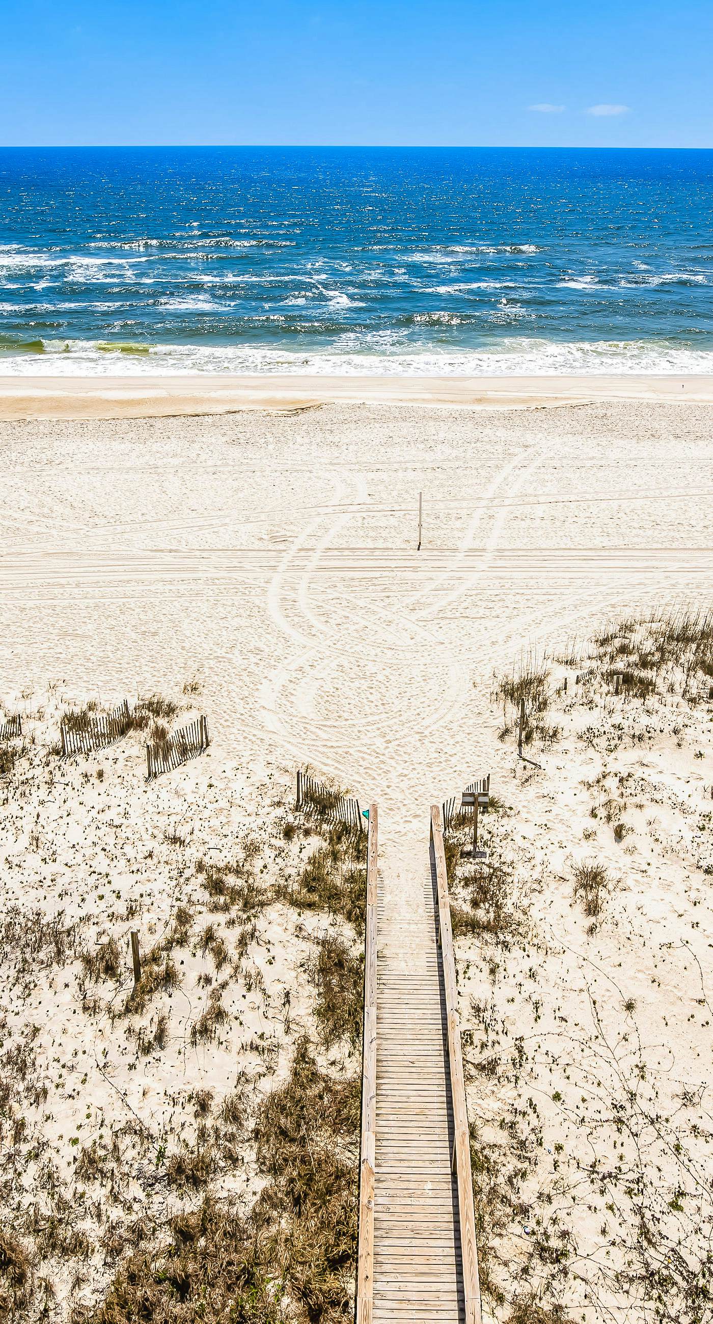 Gulf-front condo with balcony, pool, central AC, & grill