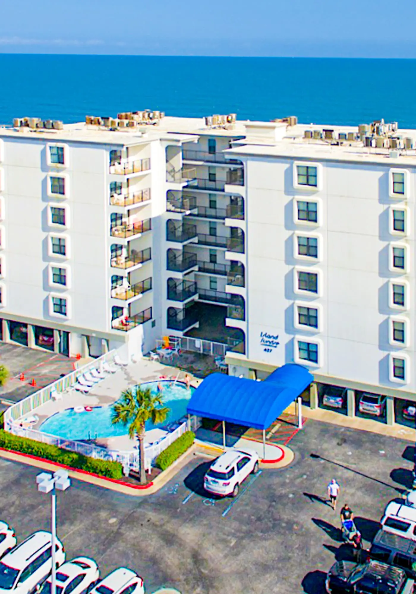 Gulf-front condo with balcony, pool, central AC, & grill