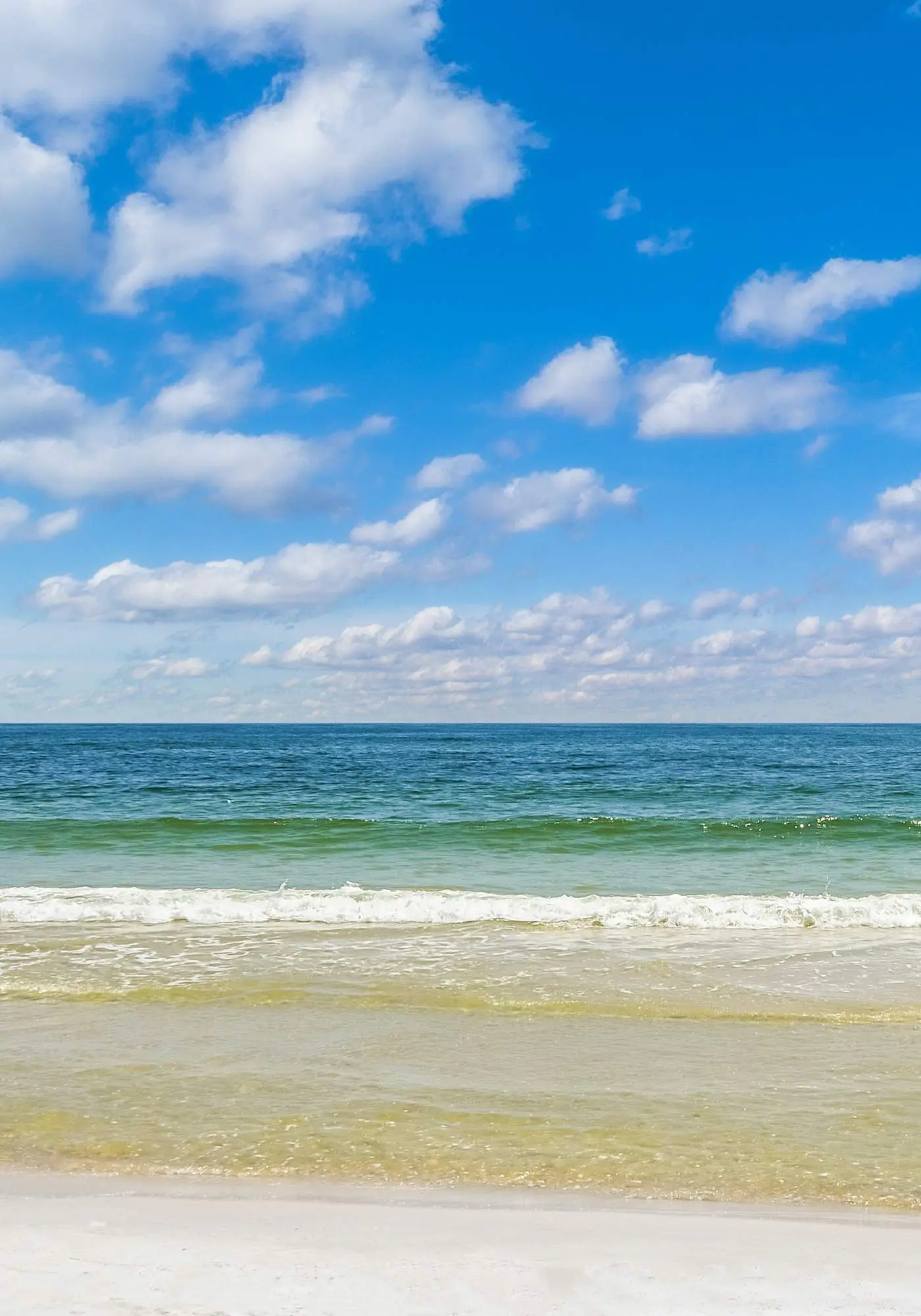 Gulf-front condo with balcony, pool, central AC, & grill