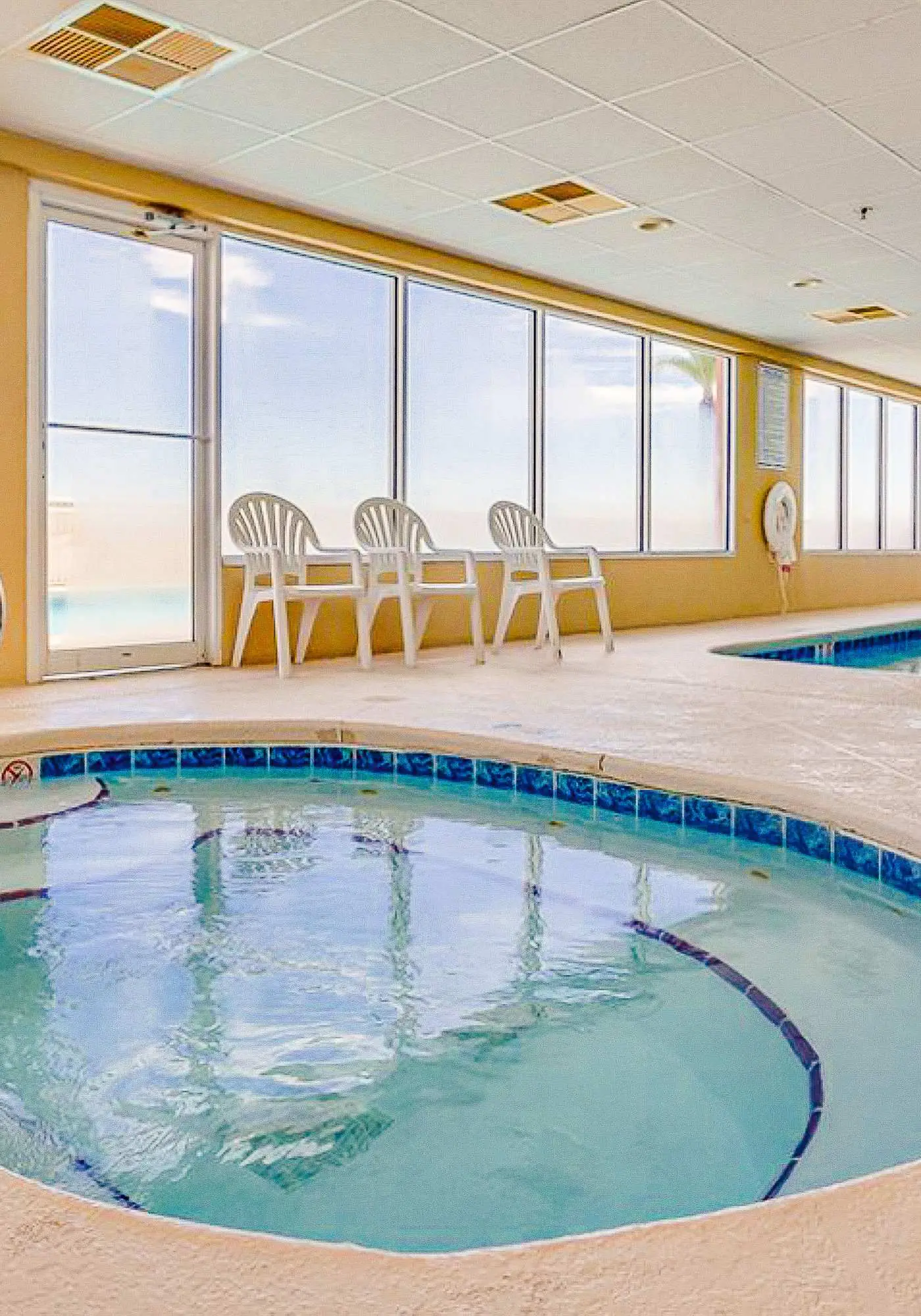 Serene Gulf-front condo with pool, hot tub, sauna, washer/dryer, & central AC