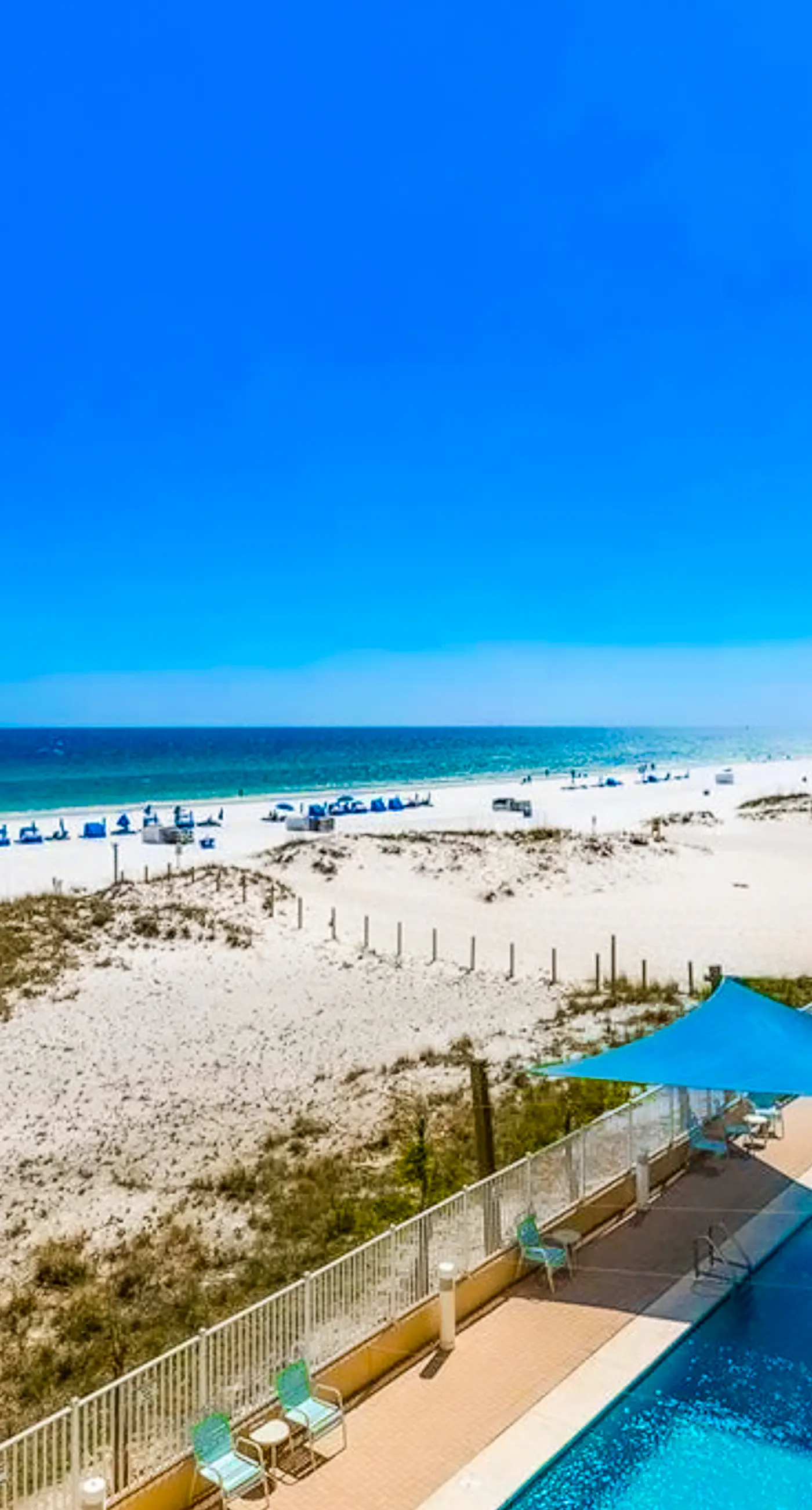 Gulf-front condo with pool, sauna, washer dryer, central AC, & gym