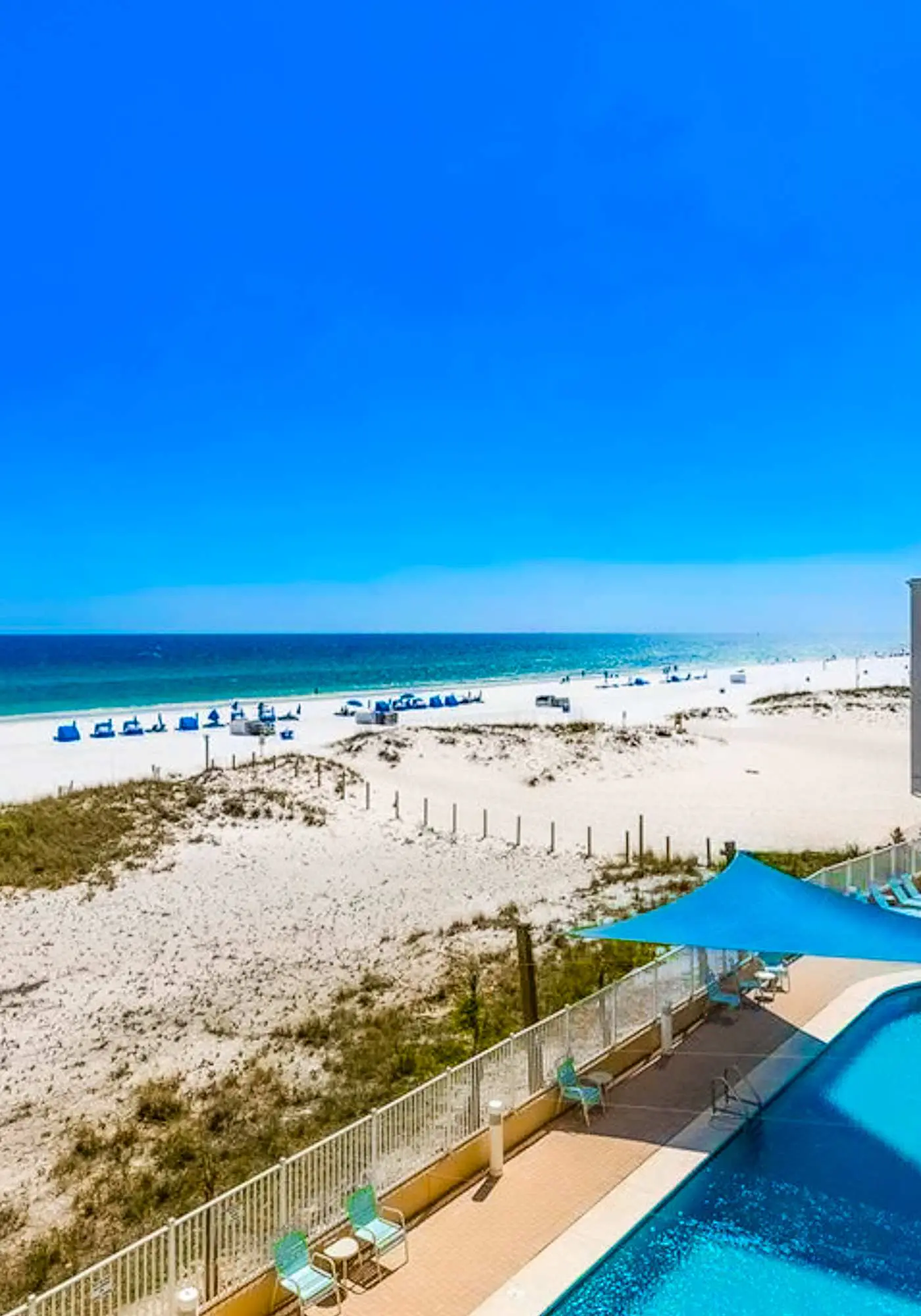Gulf-front condo with pool, sauna, washer dryer, central AC, & gym