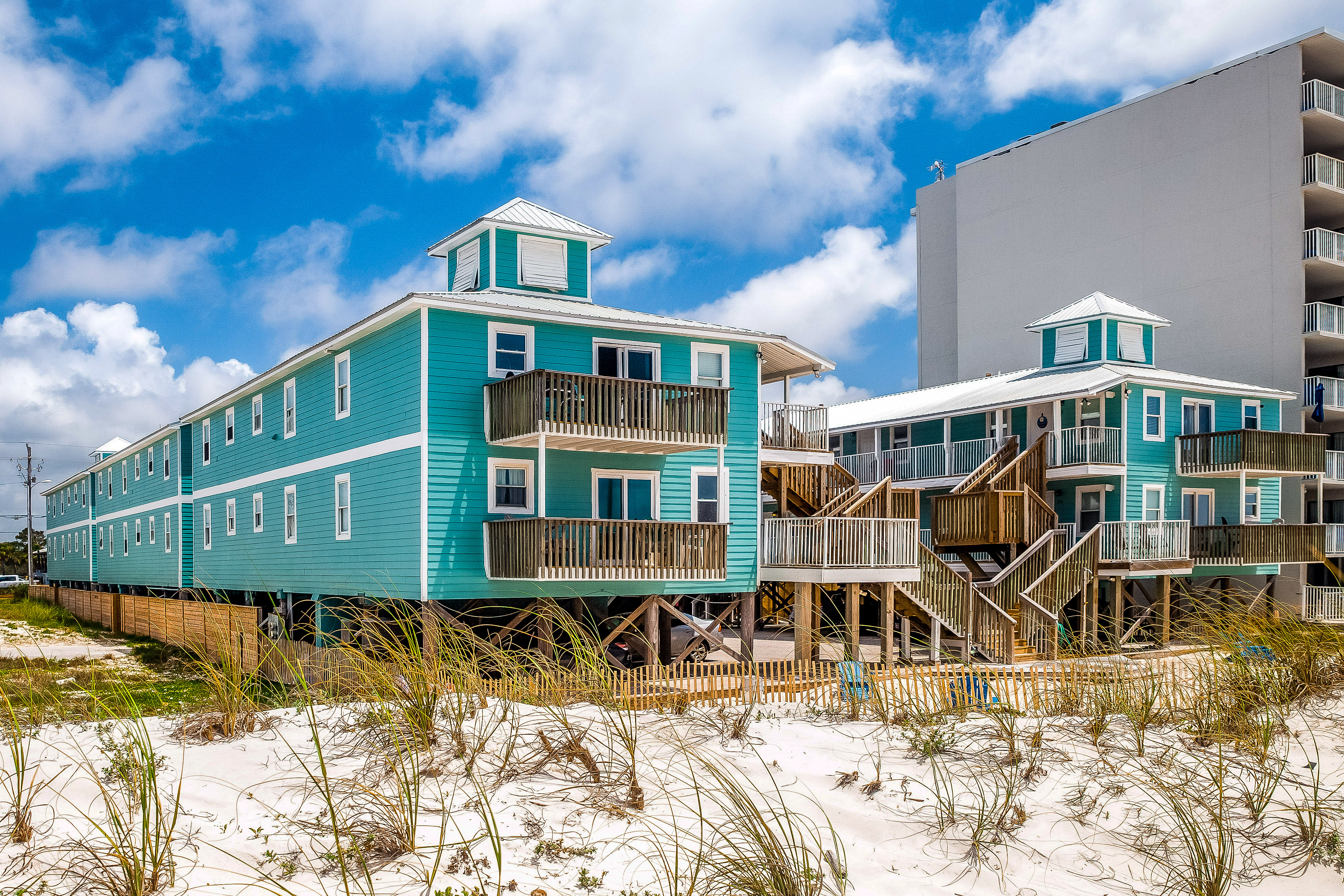 Beachside home steps from the water with pool access & central AC