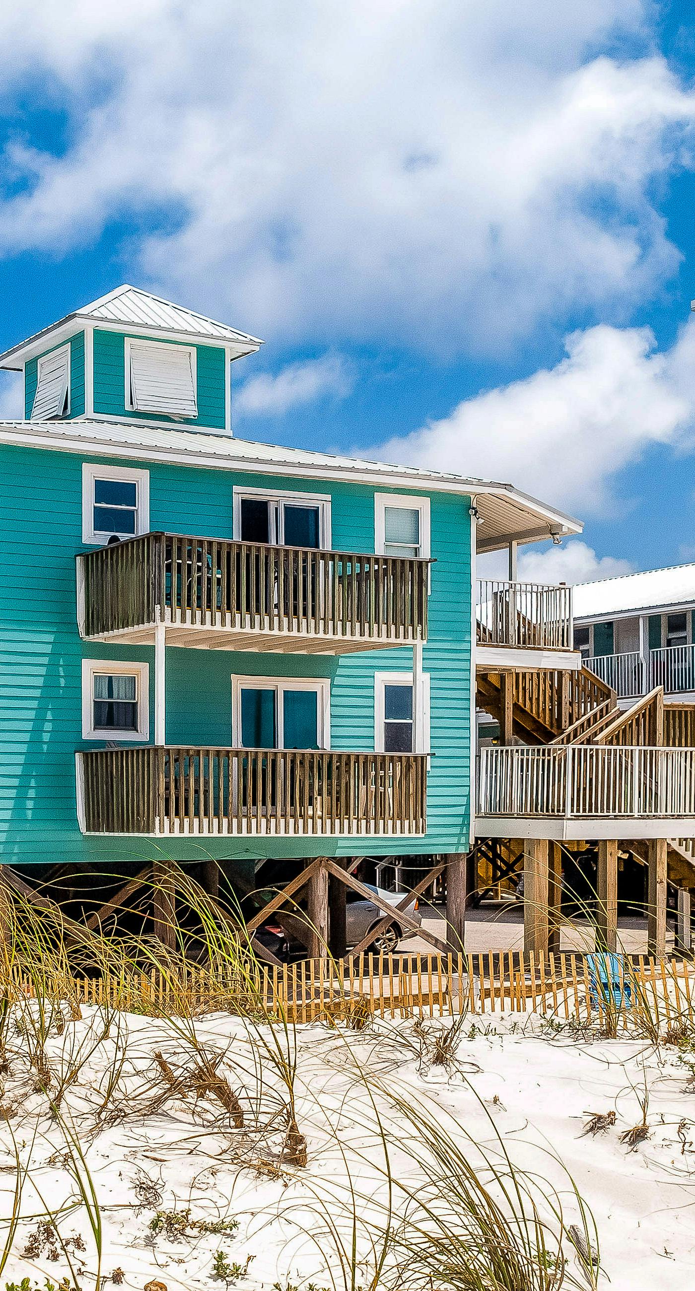 Beachside home steps from the water with pool access & central AC