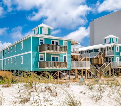 Beachside home steps from the water with pool access & central AC