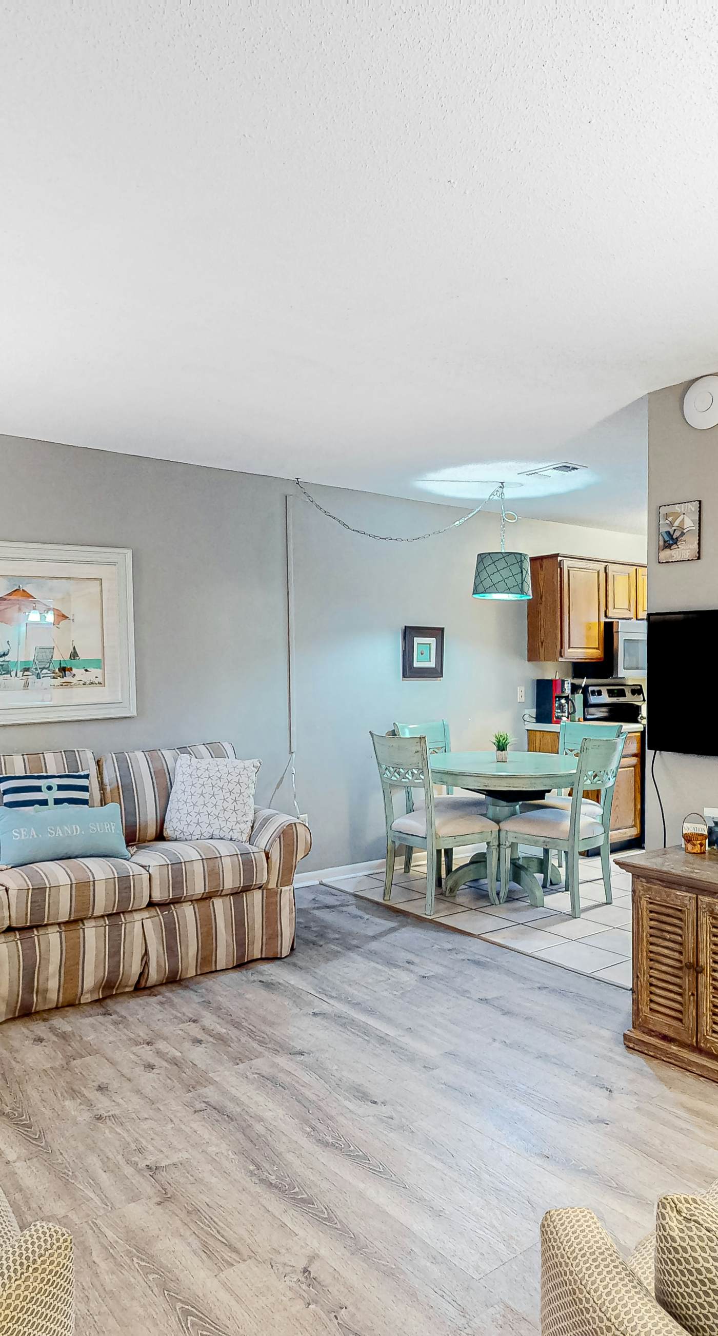 First-floor dog-friendly condo with on-site pool, beach access, & balcony