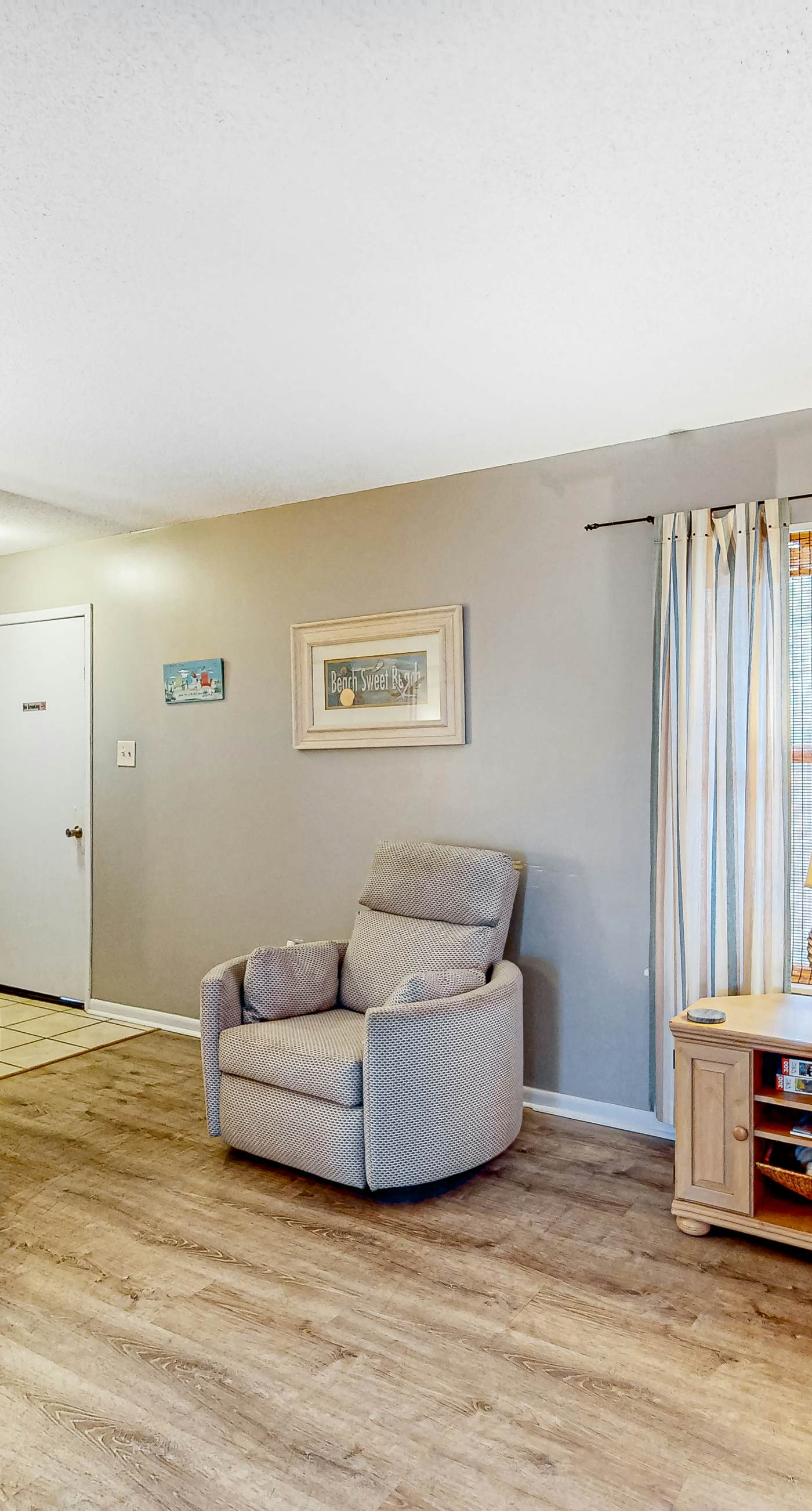 First-floor dog-friendly condo with on-site pool, beach access, & balcony